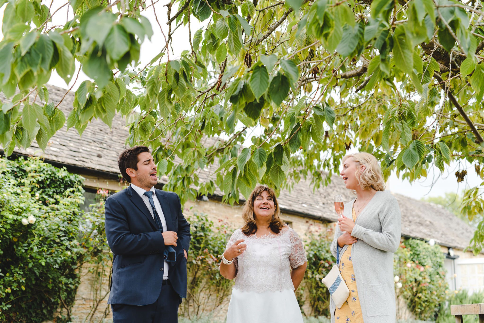 Drinks reception candid photograps of wedding guests at Merriscourt