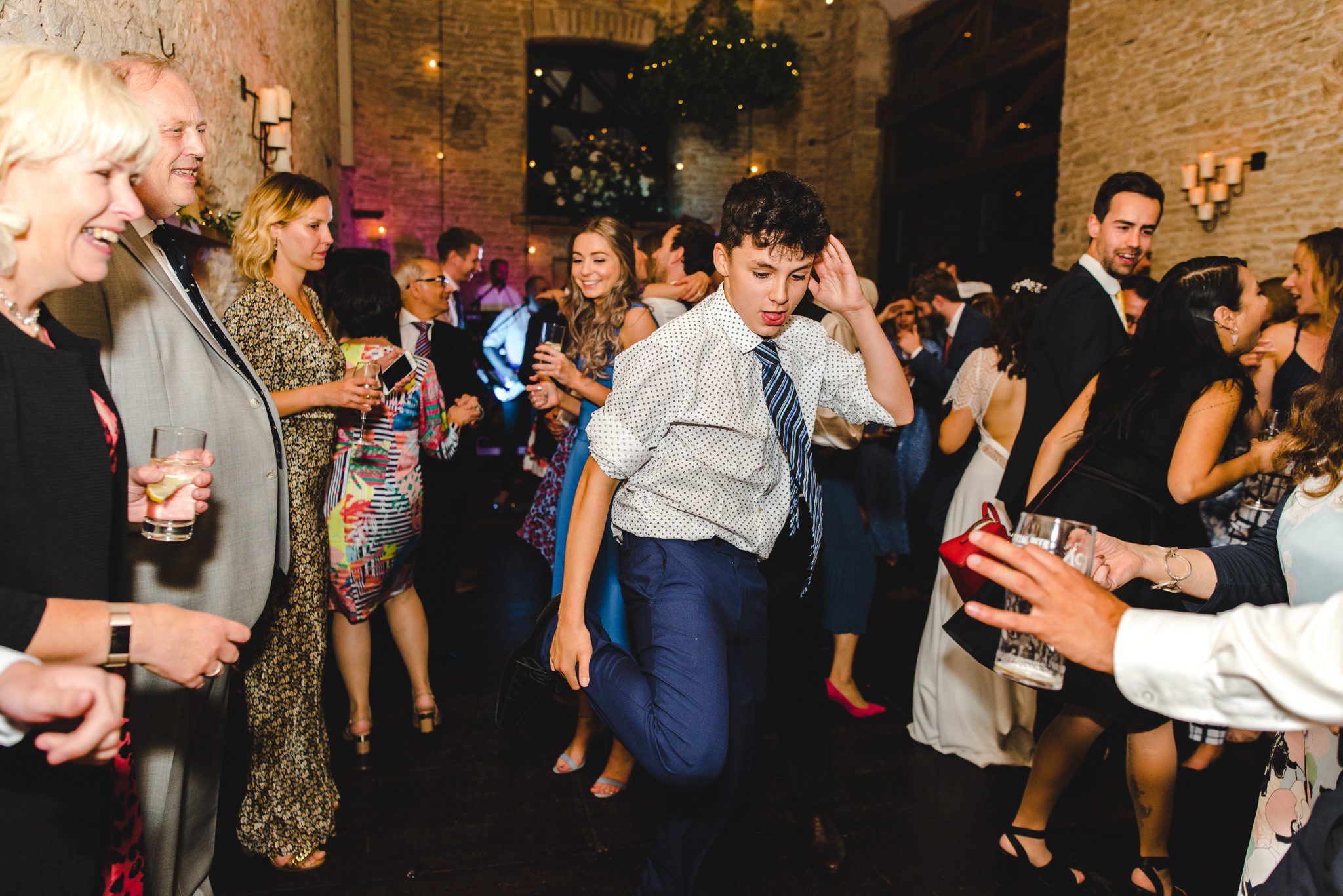 A wedding guest dancing in Gloucestershire