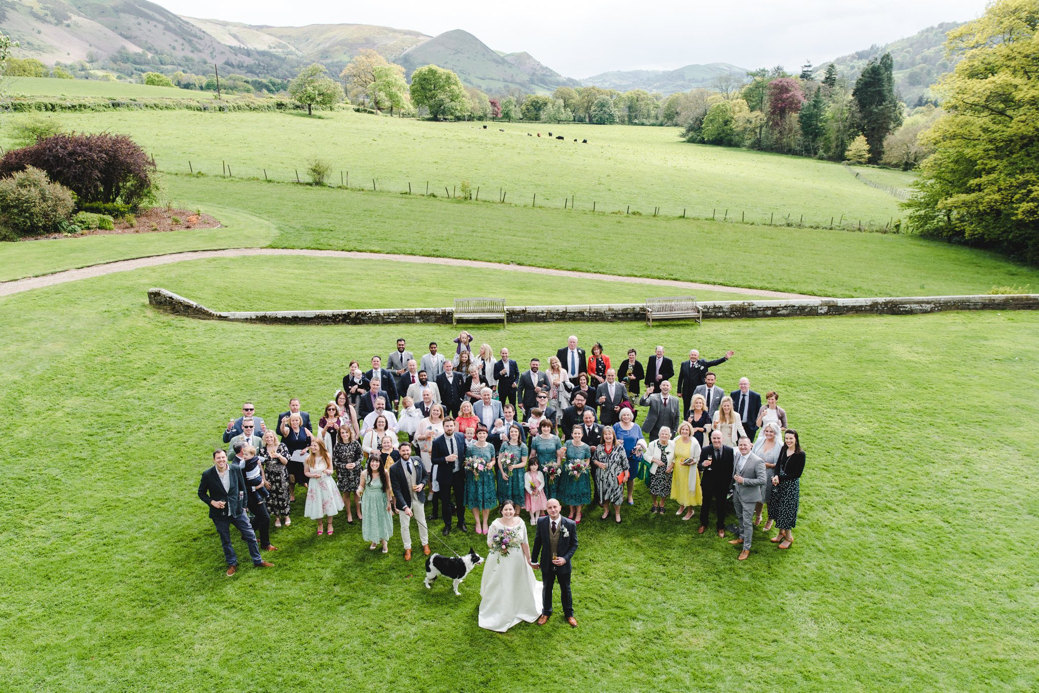A group shot at a wedding showing the hills