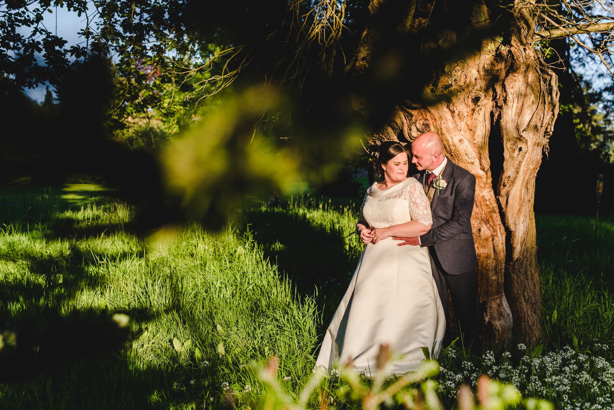 A couple stood in beautiful light at Plas Dinam