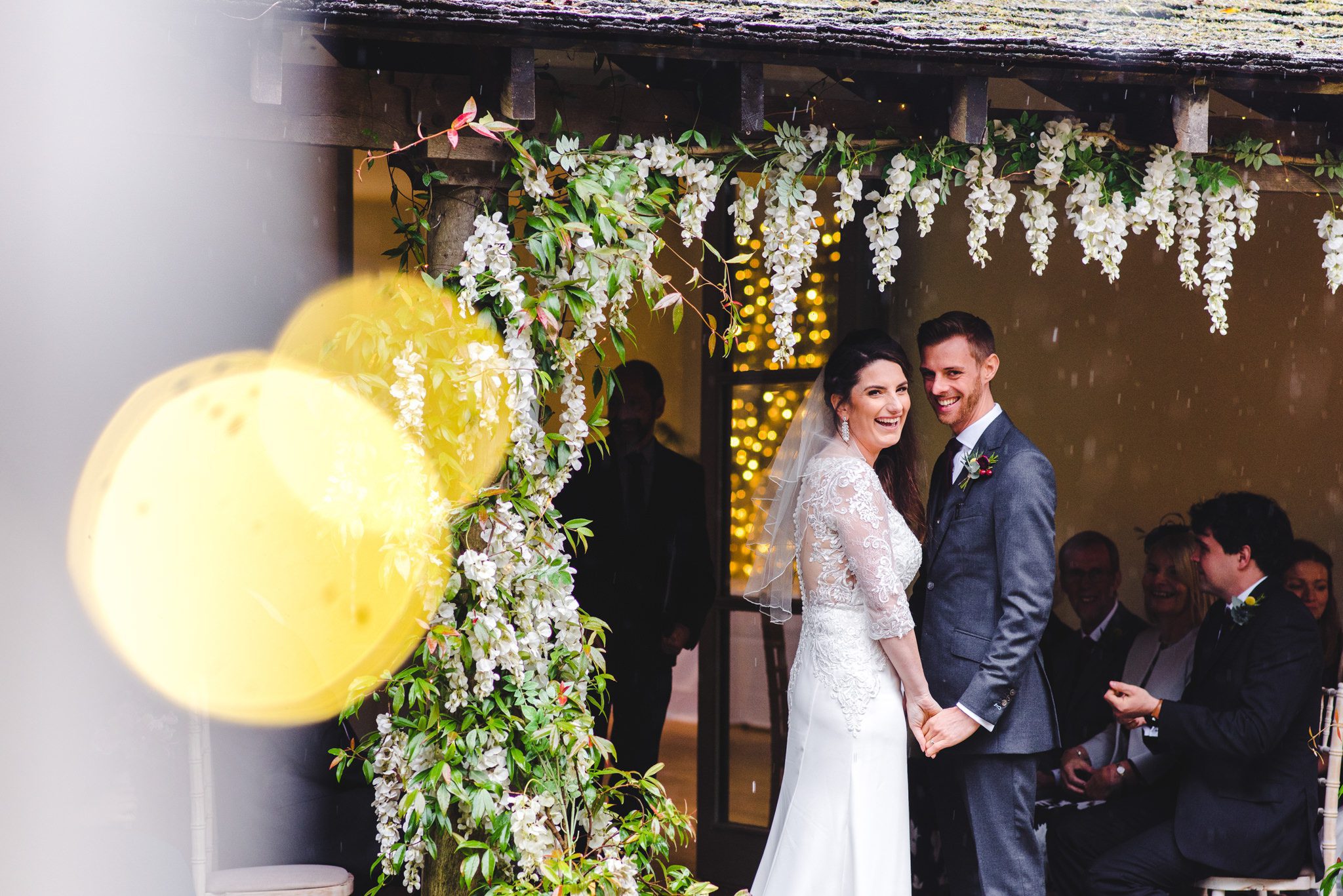 An outdoor wedding ceremony with fairy lights