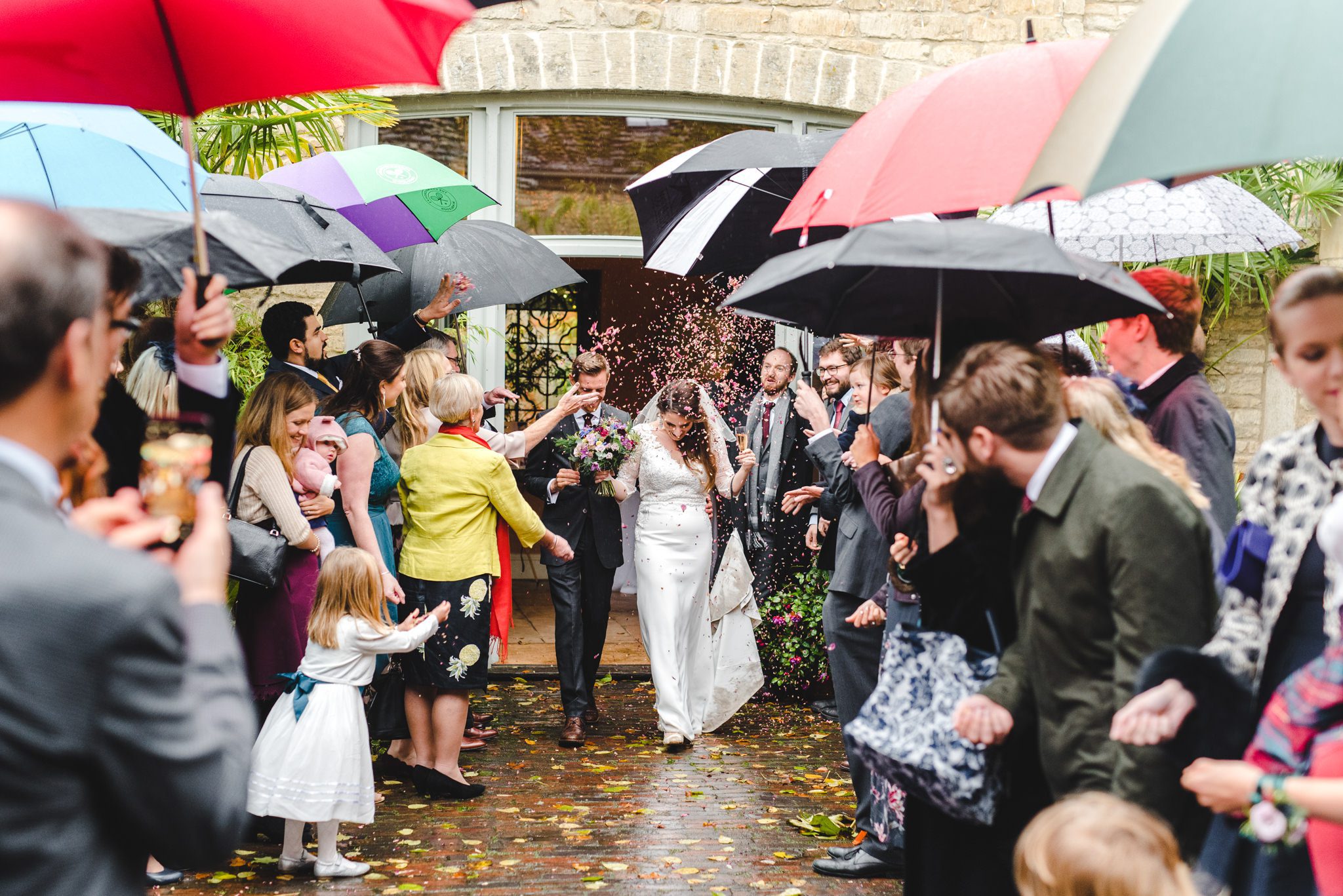 Confetti walk under lots of umbrellas