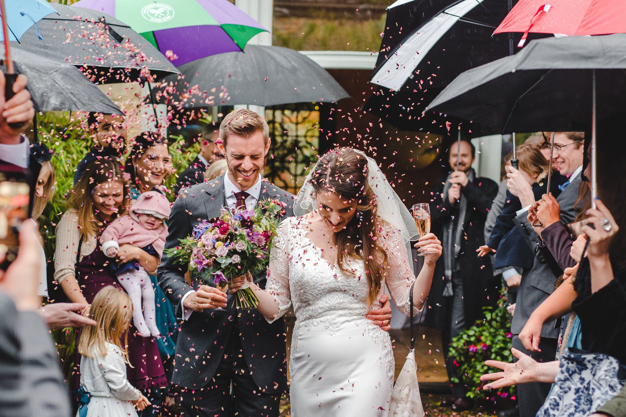 Confetti walk under lots of umbrellas