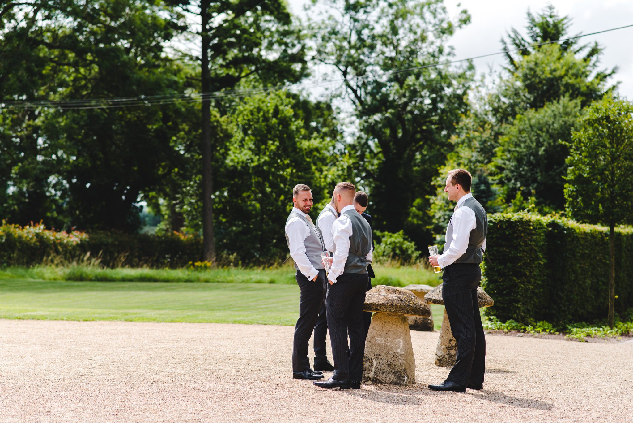 The groomsmen chatting before the wedding ceremony at Hyde House