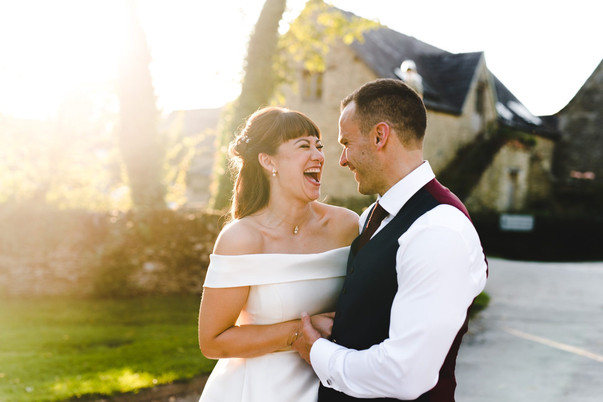 A bride and groom laughing together