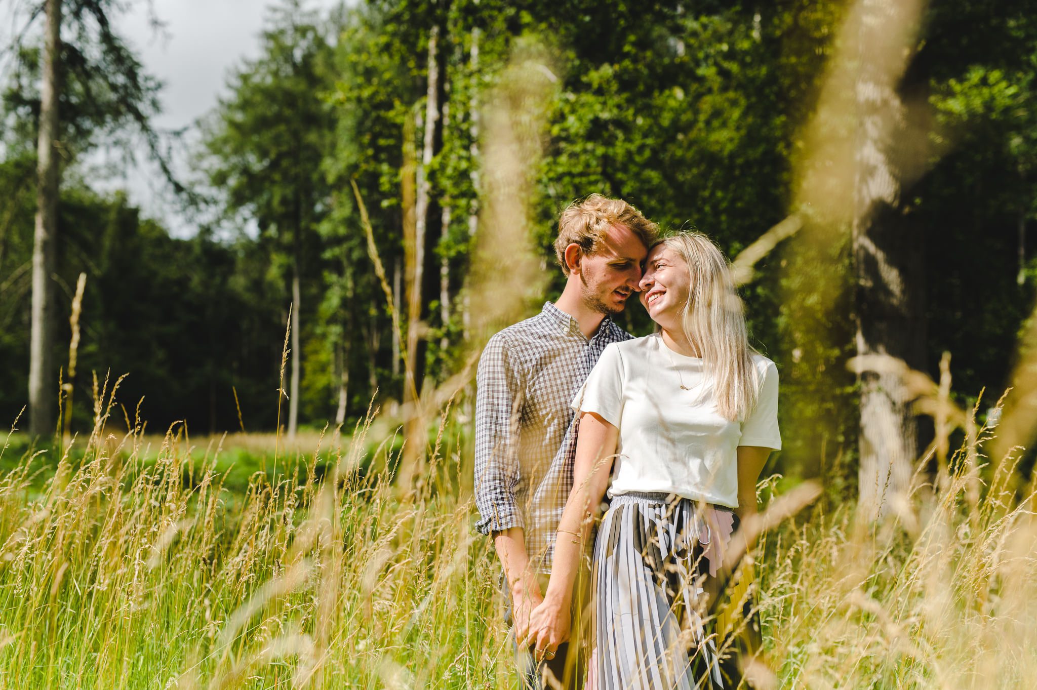 An engaged couple gazing into each others eyes