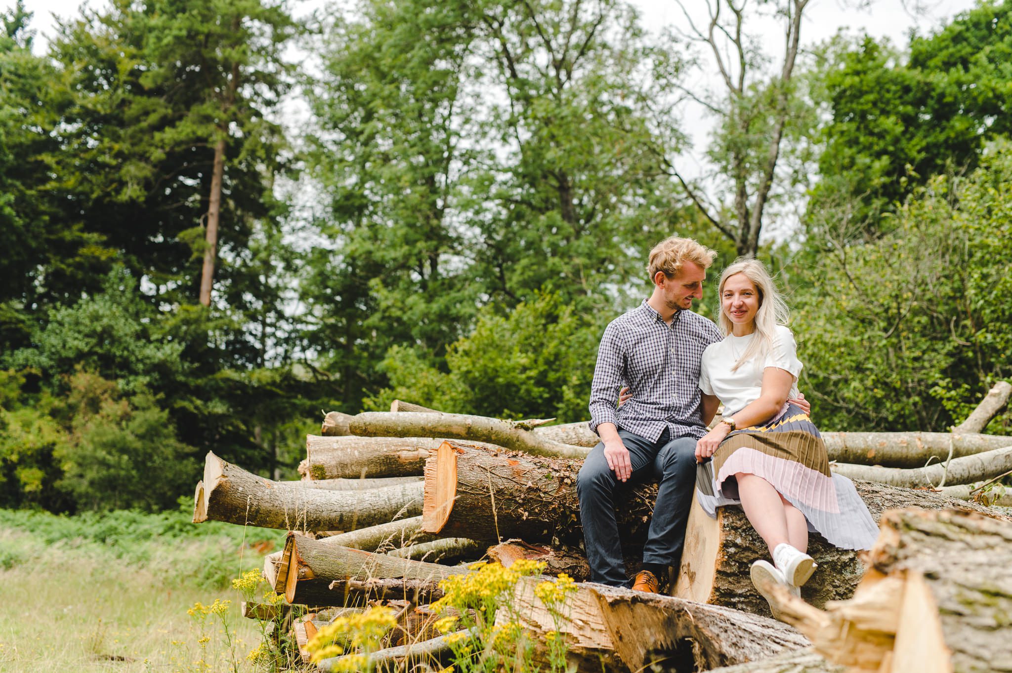 People sat on a log pile