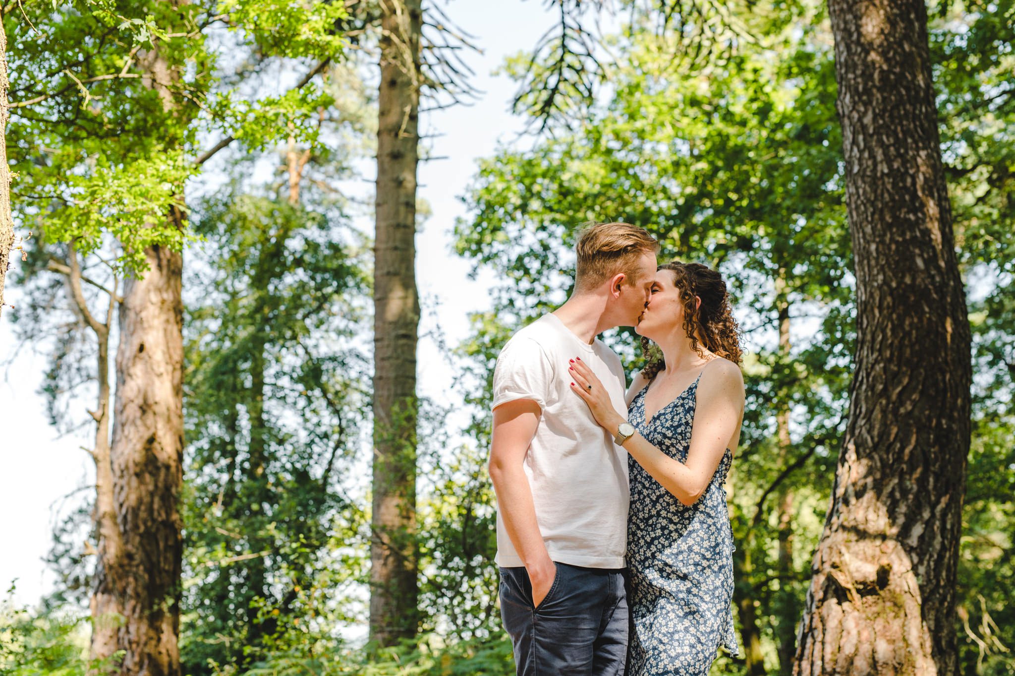 A couple in the forest on their engagement shoot