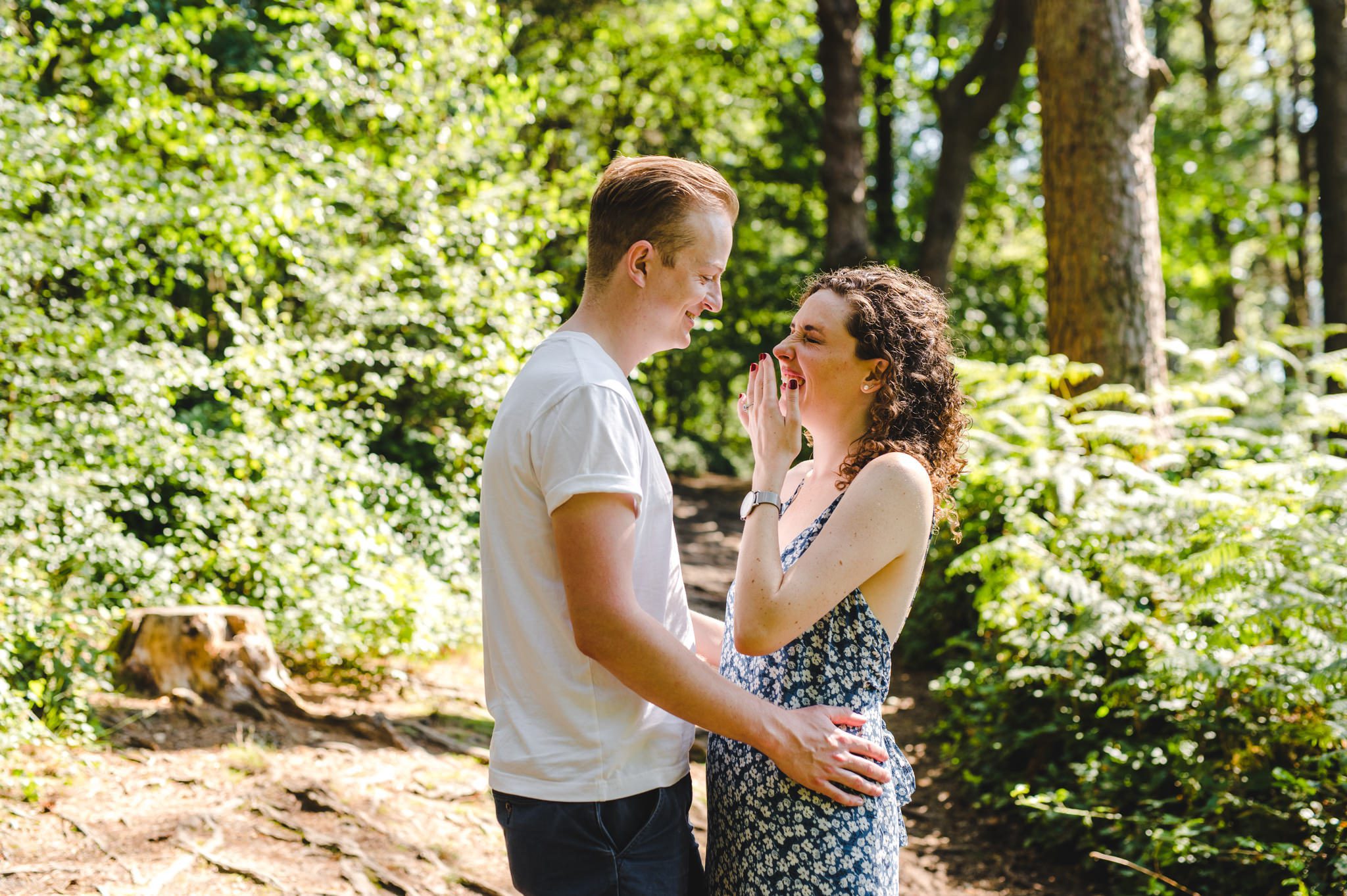 A bride to be laughing at her groom