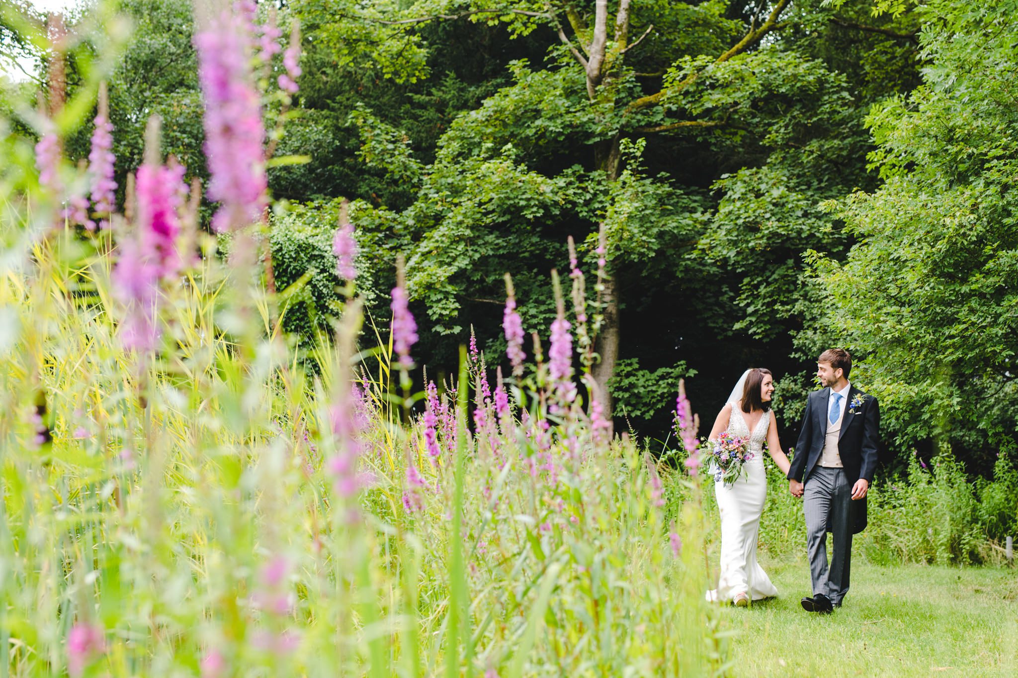 Pictures of a bride and grrom in the beautiful grounds of The Matara Centre near Tetbury