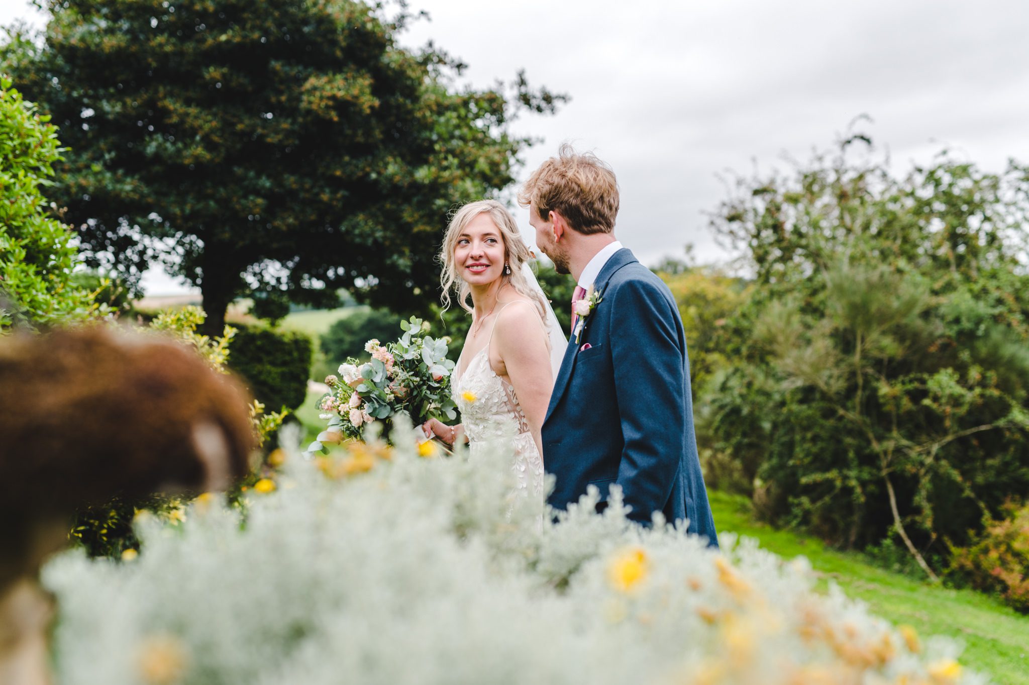 A bride looking at her groom