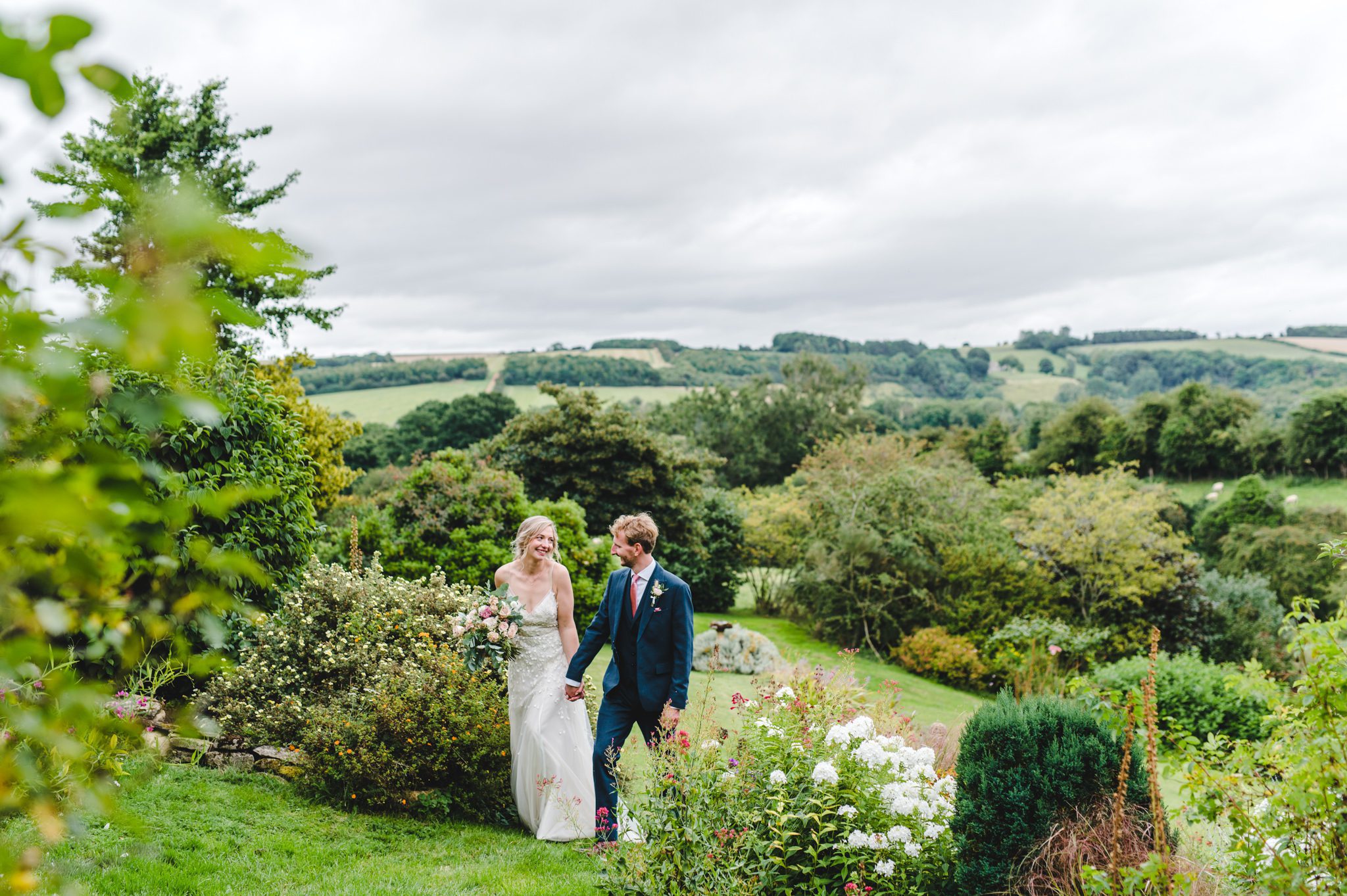 A bride and groom in Cotswolds scenery