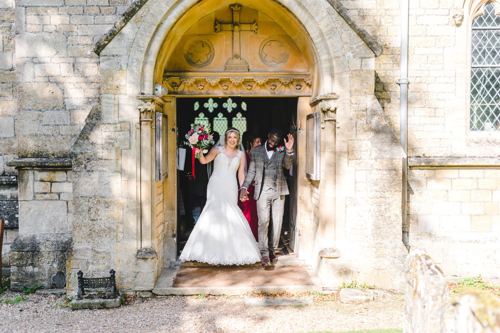 A bride and groom exiting the church