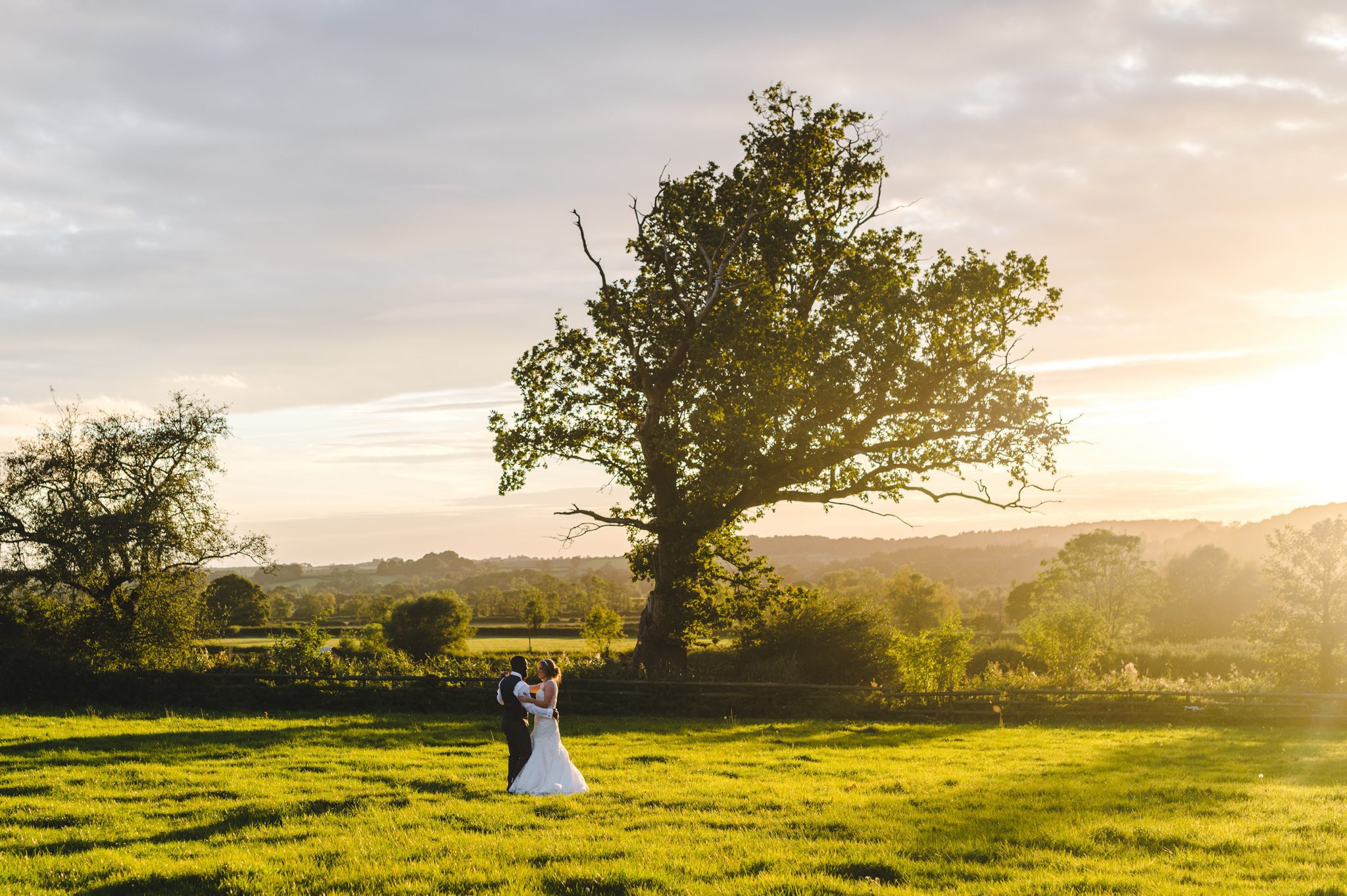 A bride and groom at sunset at Hyde House