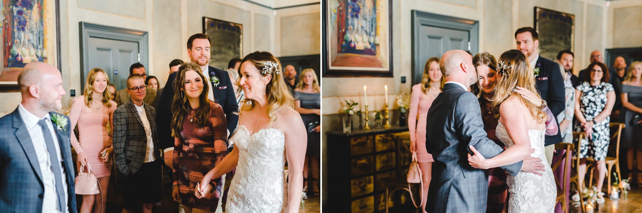 A bride and her family hugging at the top of the aisle