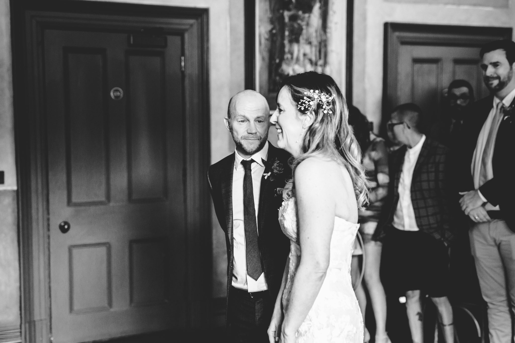 A groom getting emotional on seeing his bride