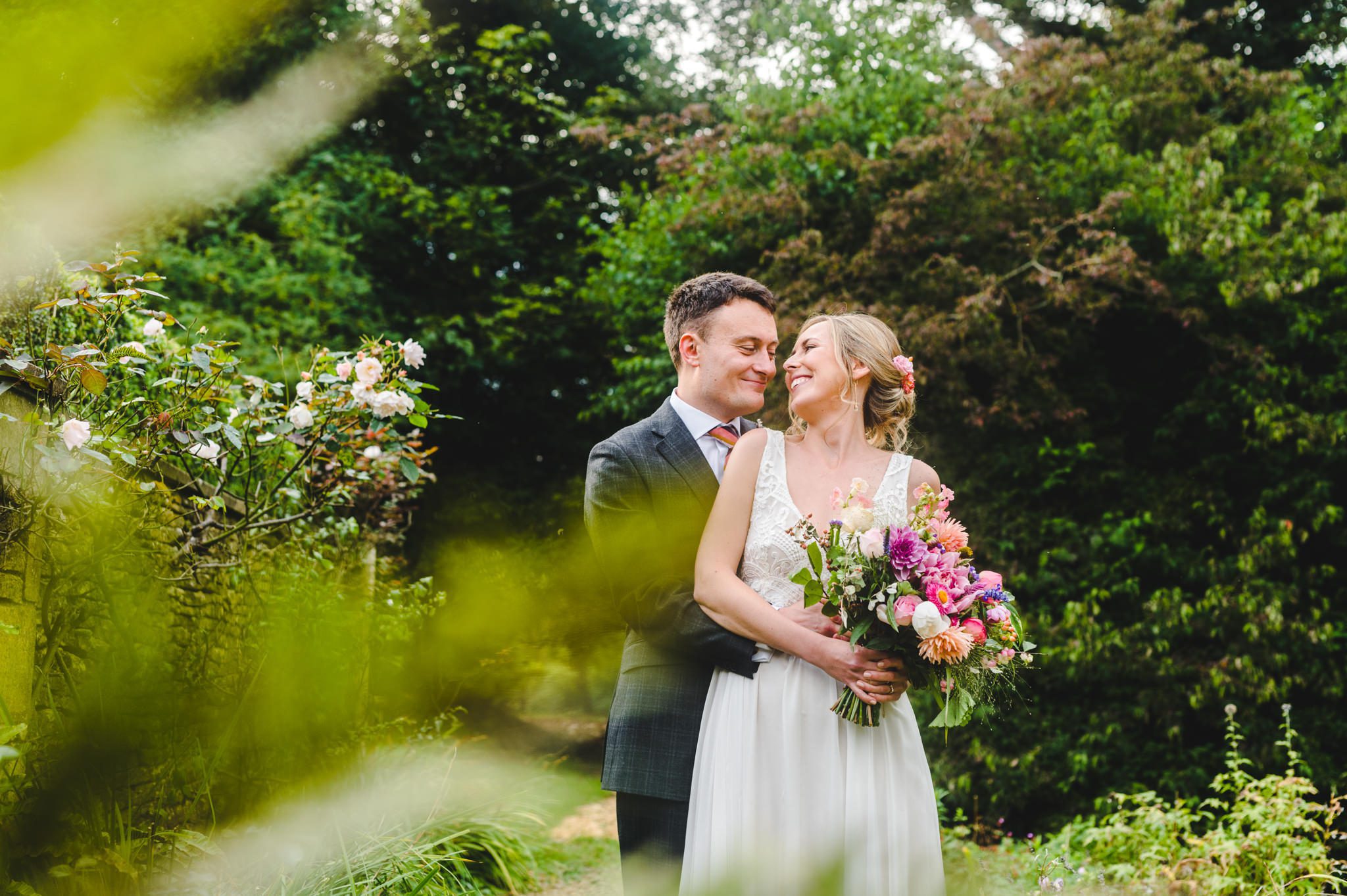 A beautiful editorial style image of a couple at Owlpen Manor on their wedding day in Gloucestershire