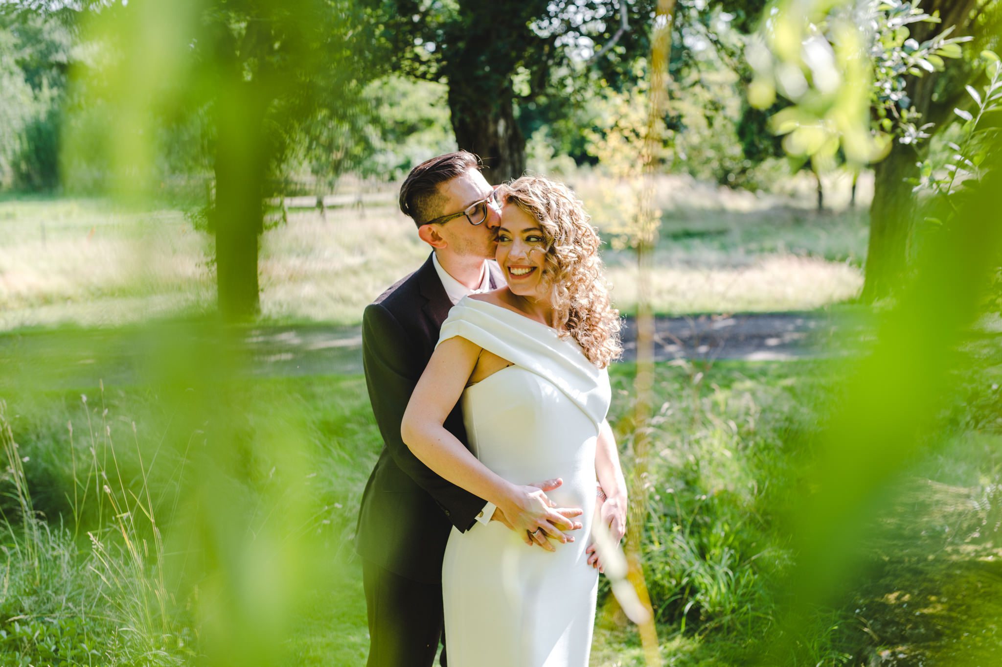 A couple hugging in the sunshine