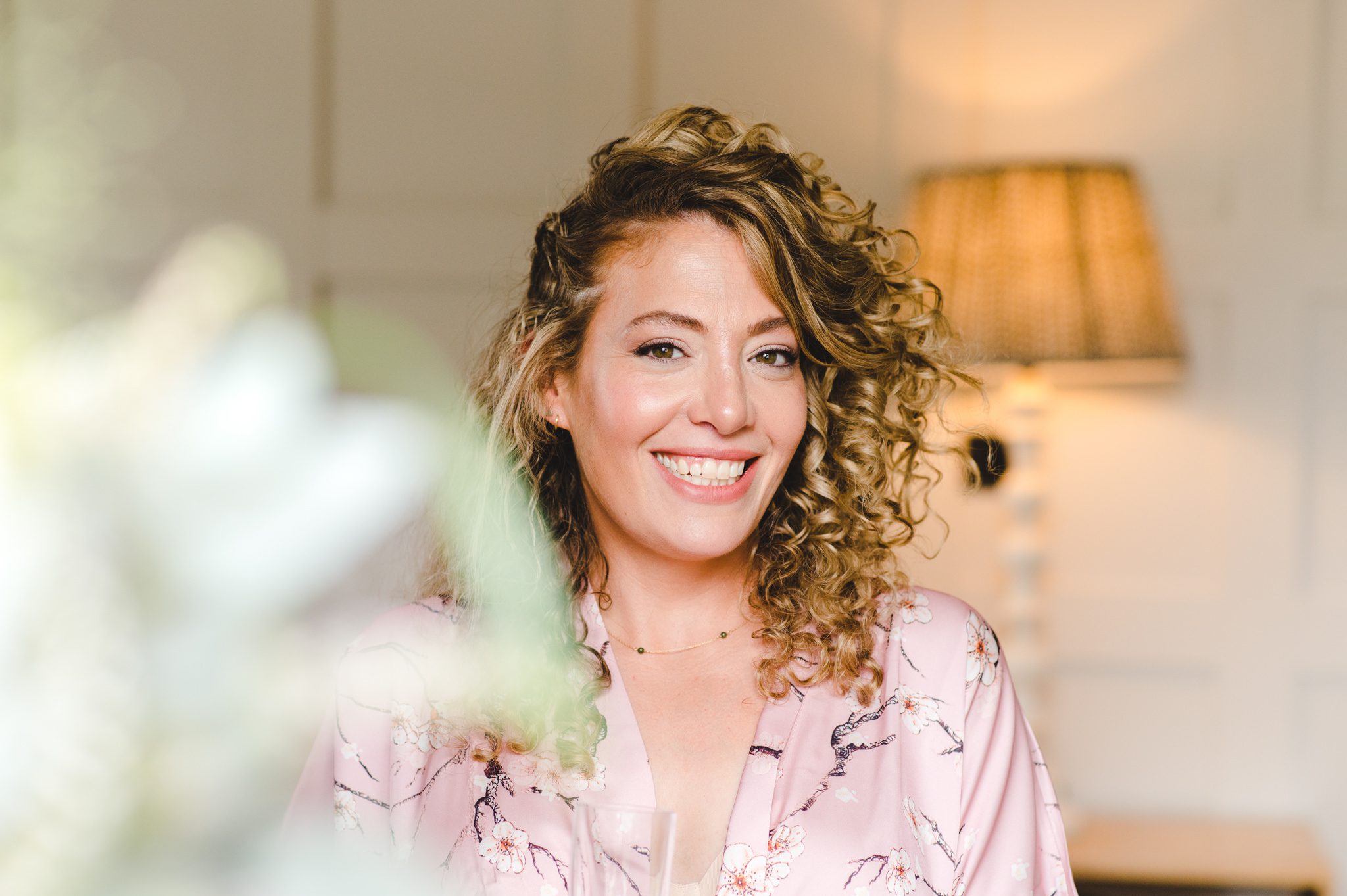 Bride getting ready with Julian Ramirez Make Up at Oxleaze Barn