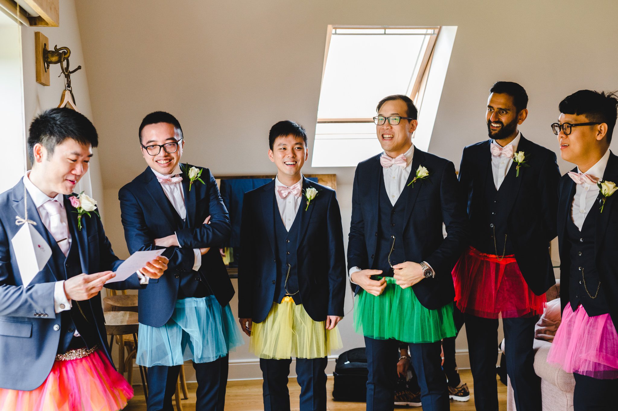 Groomsmen wearing tutus at Hyde House