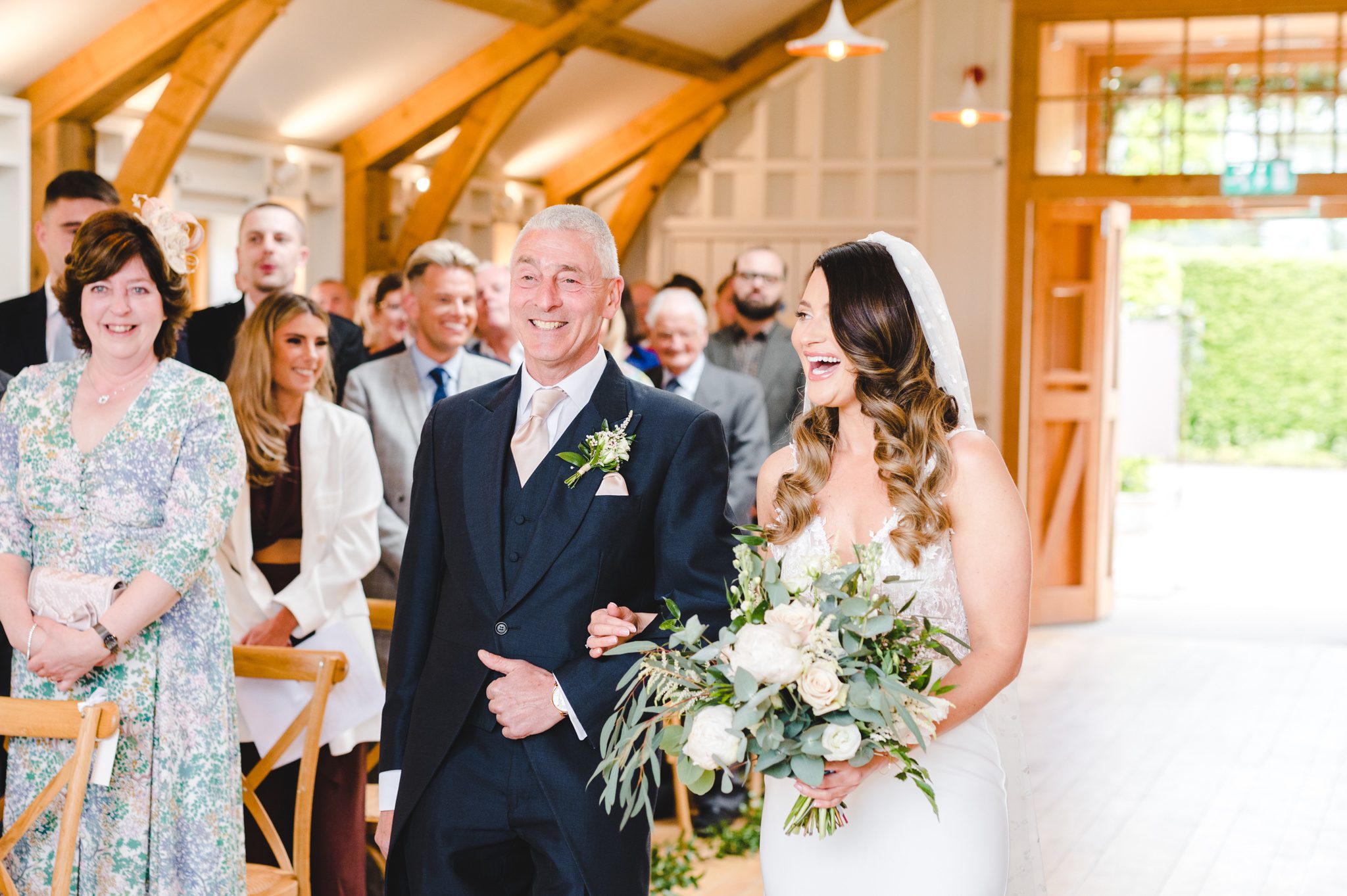 bride walking down the aisle at The Grange with her father