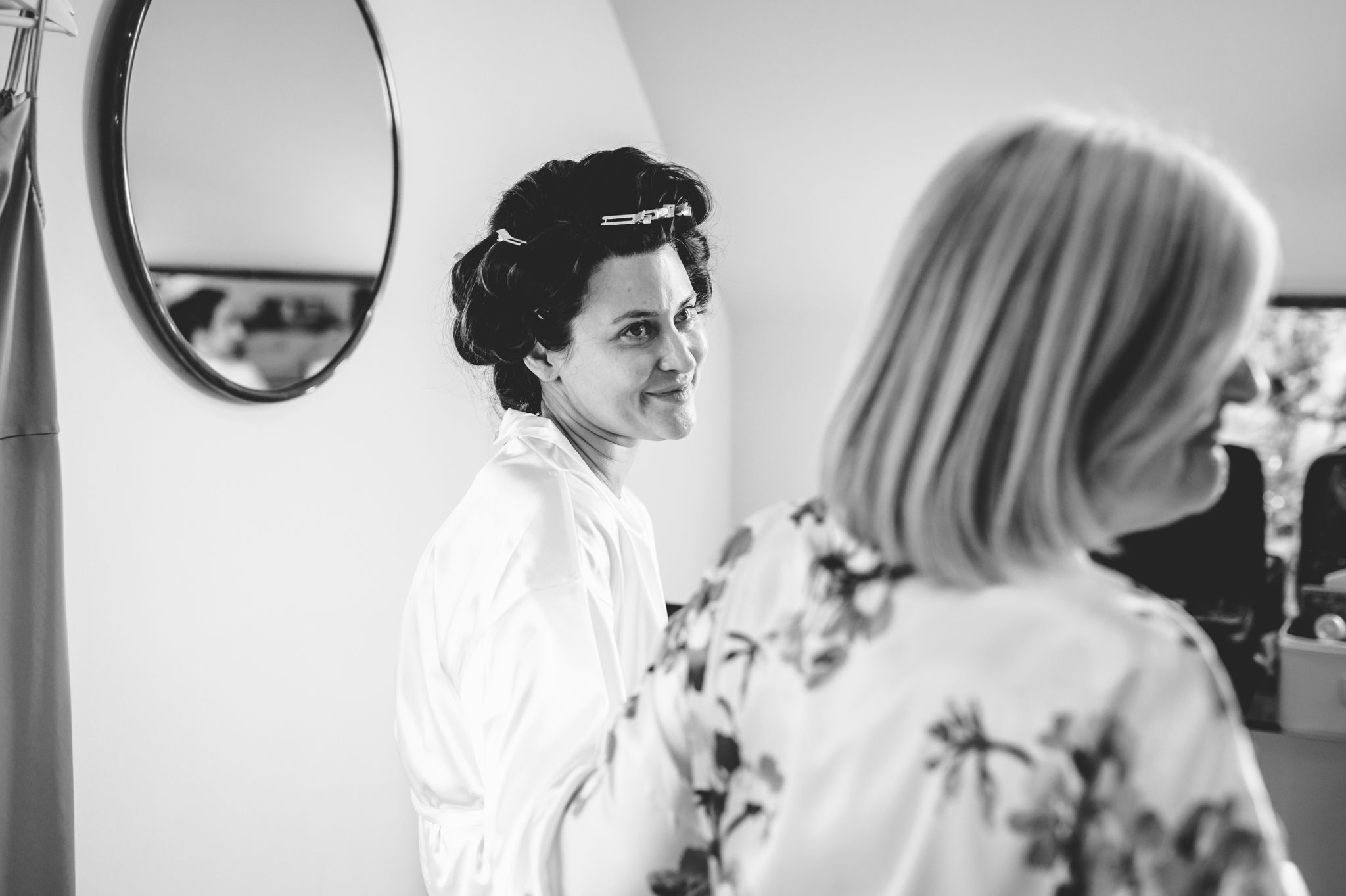 A bride looking at her mother at hyde house