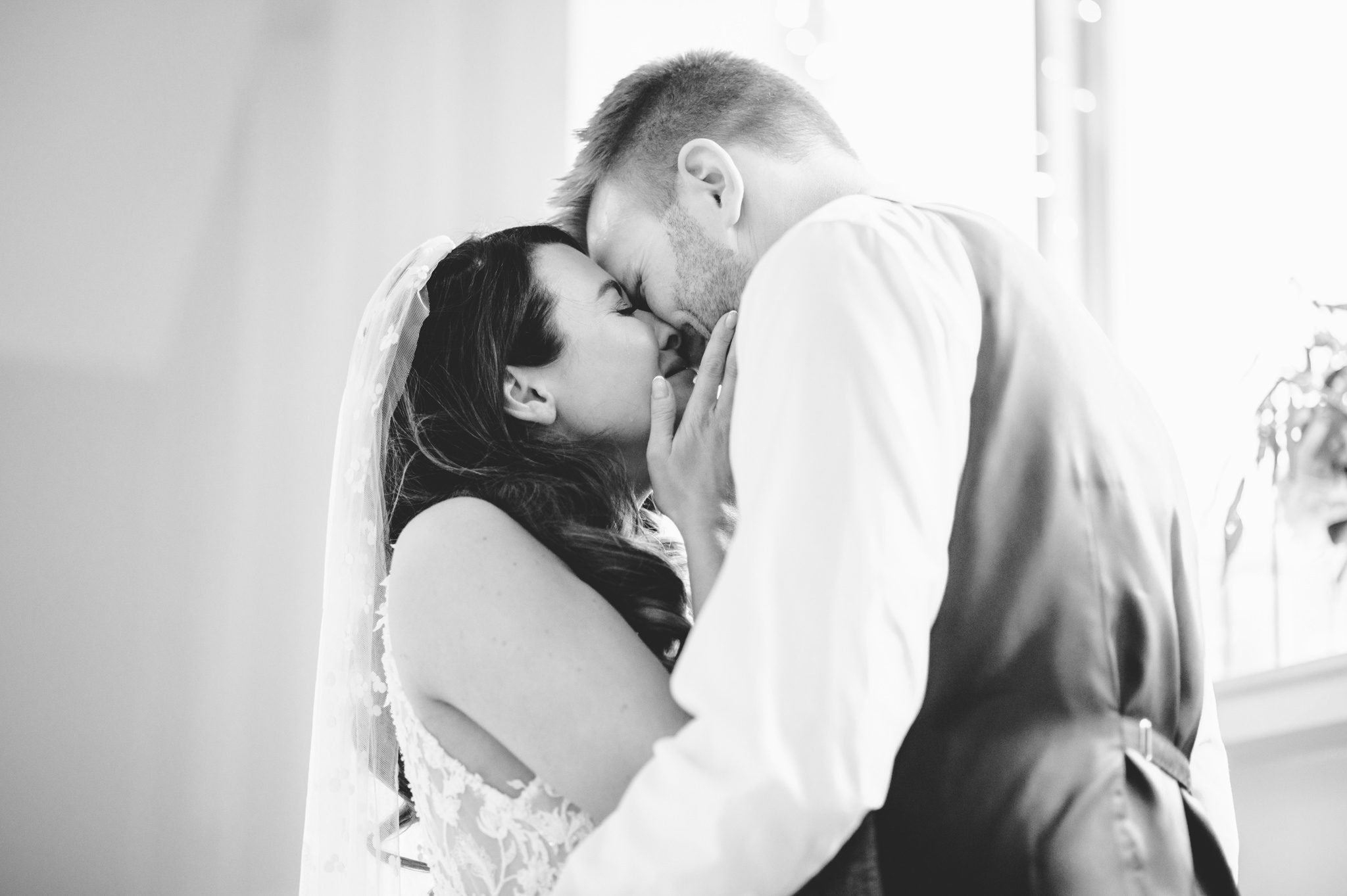 Bride and groom sharing a moment during the speeches