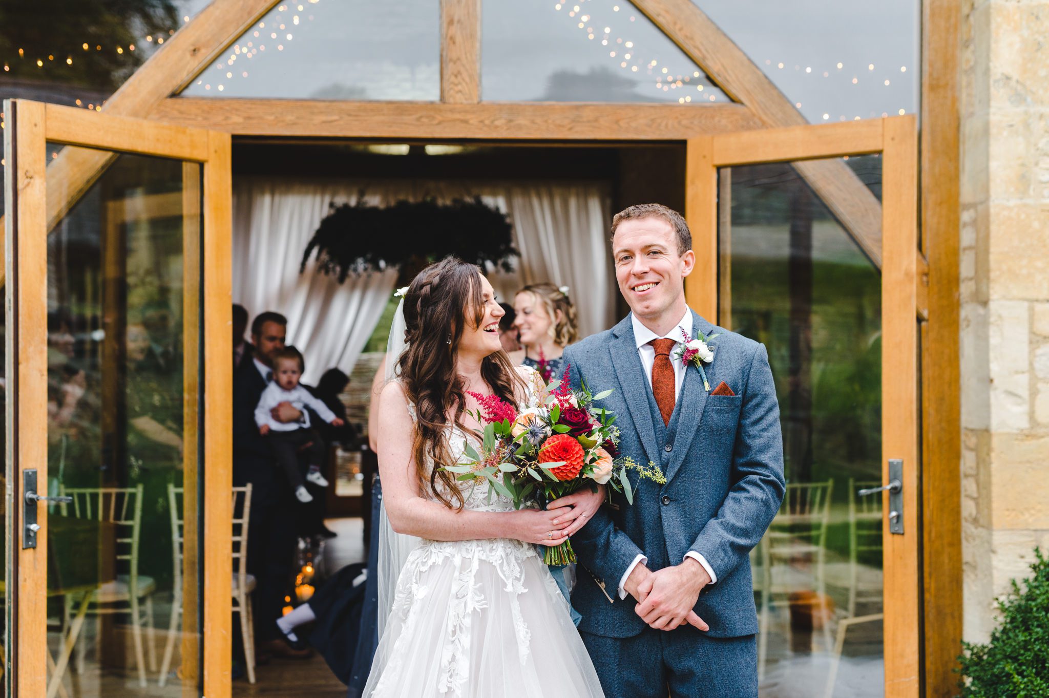 A smiling bride and groom after their wedding ceremony