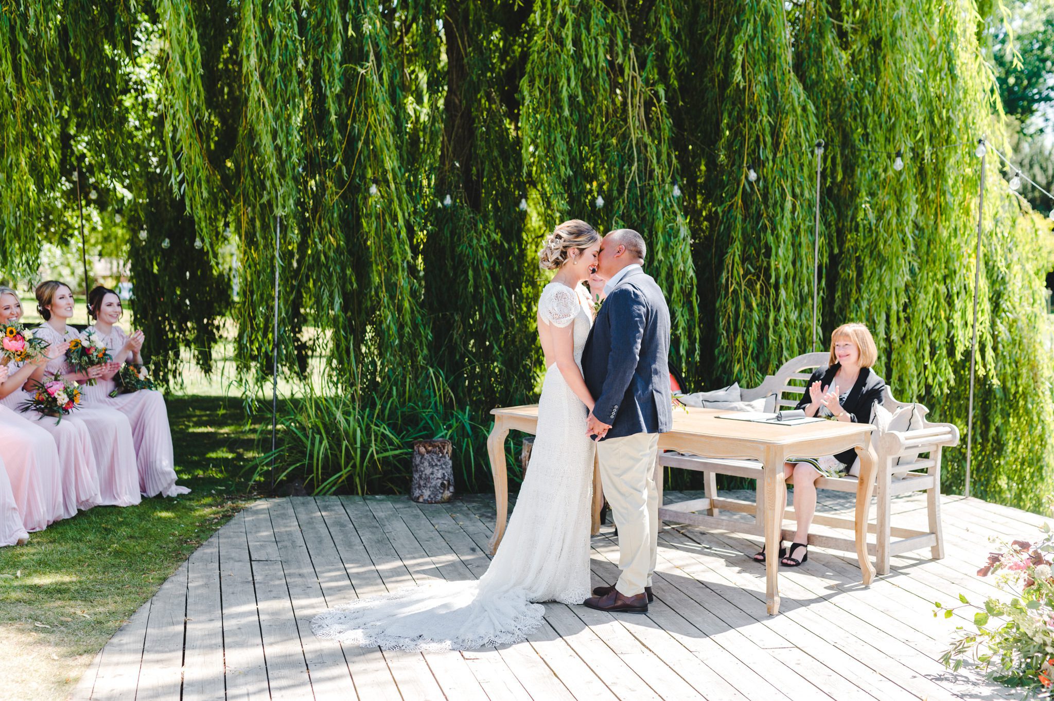 First kiss at a Barns and Yard wedding ceremony
