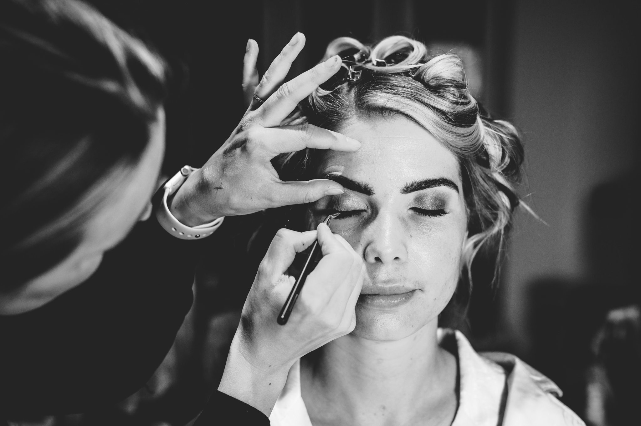 A bride having her make-up done ahead of her Upcote Barn wedding day