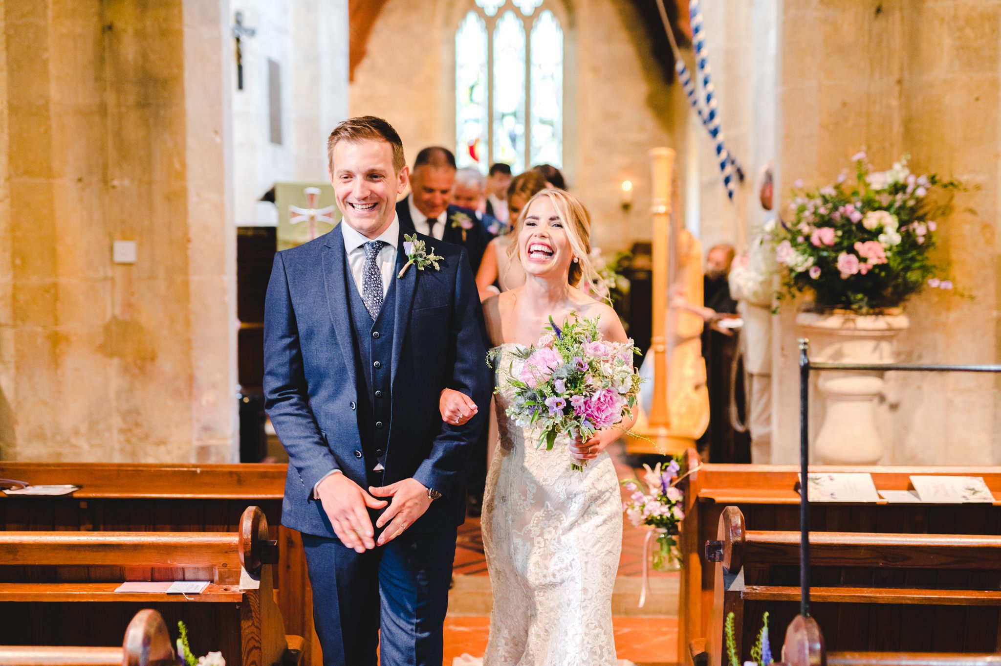 Bride and Groom walking back down the aisle as husband and wife