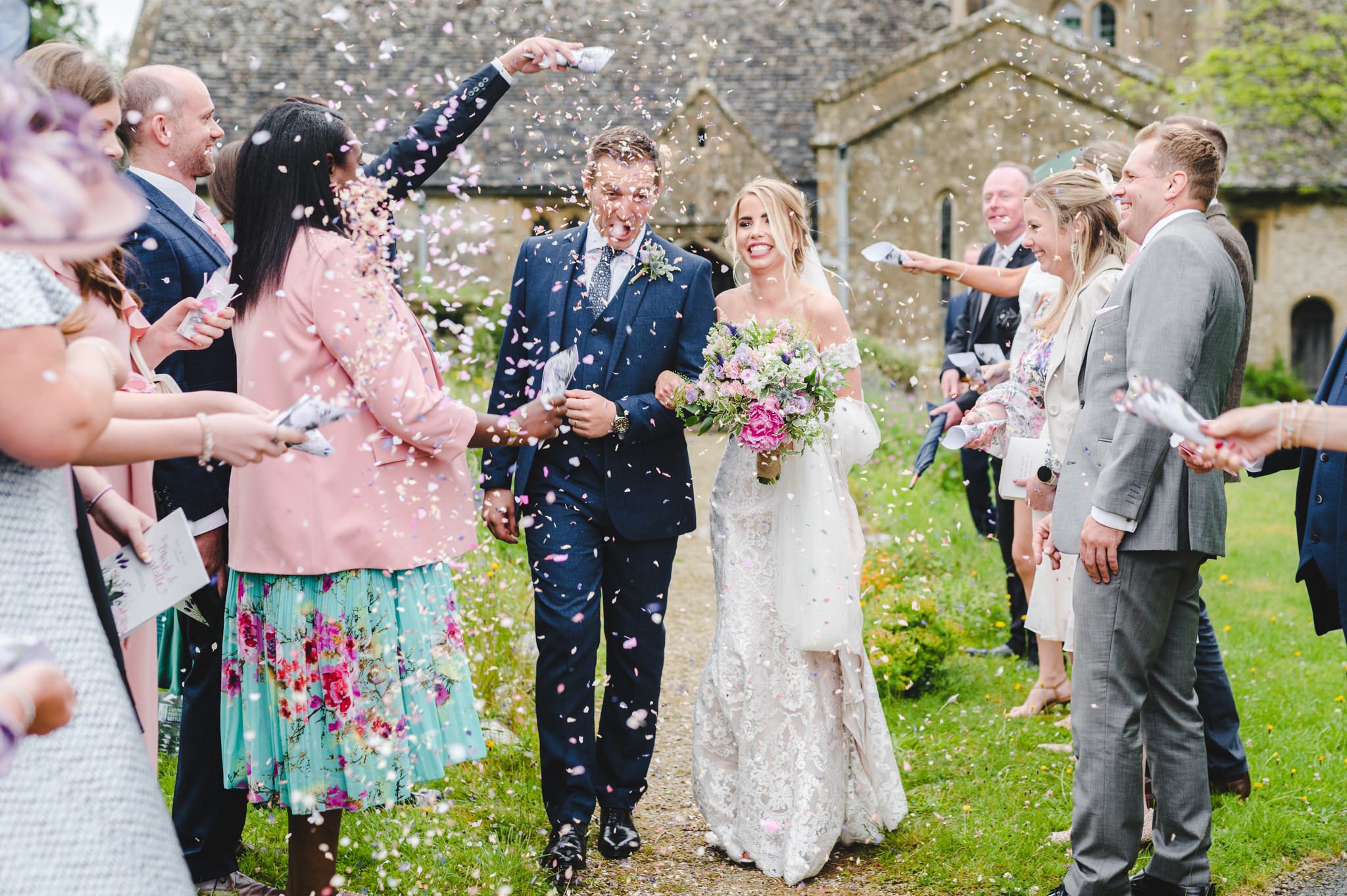 Confetti outside the church for an Upcote Barn bride