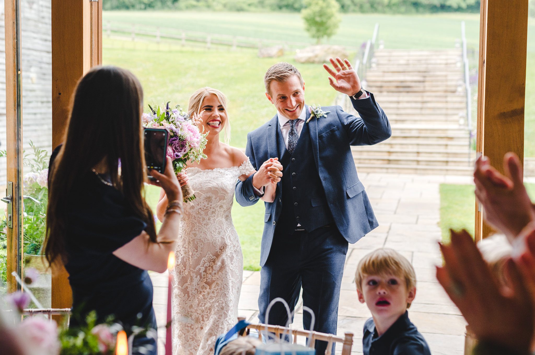 Bride and Groom entering the Barn at Upcote