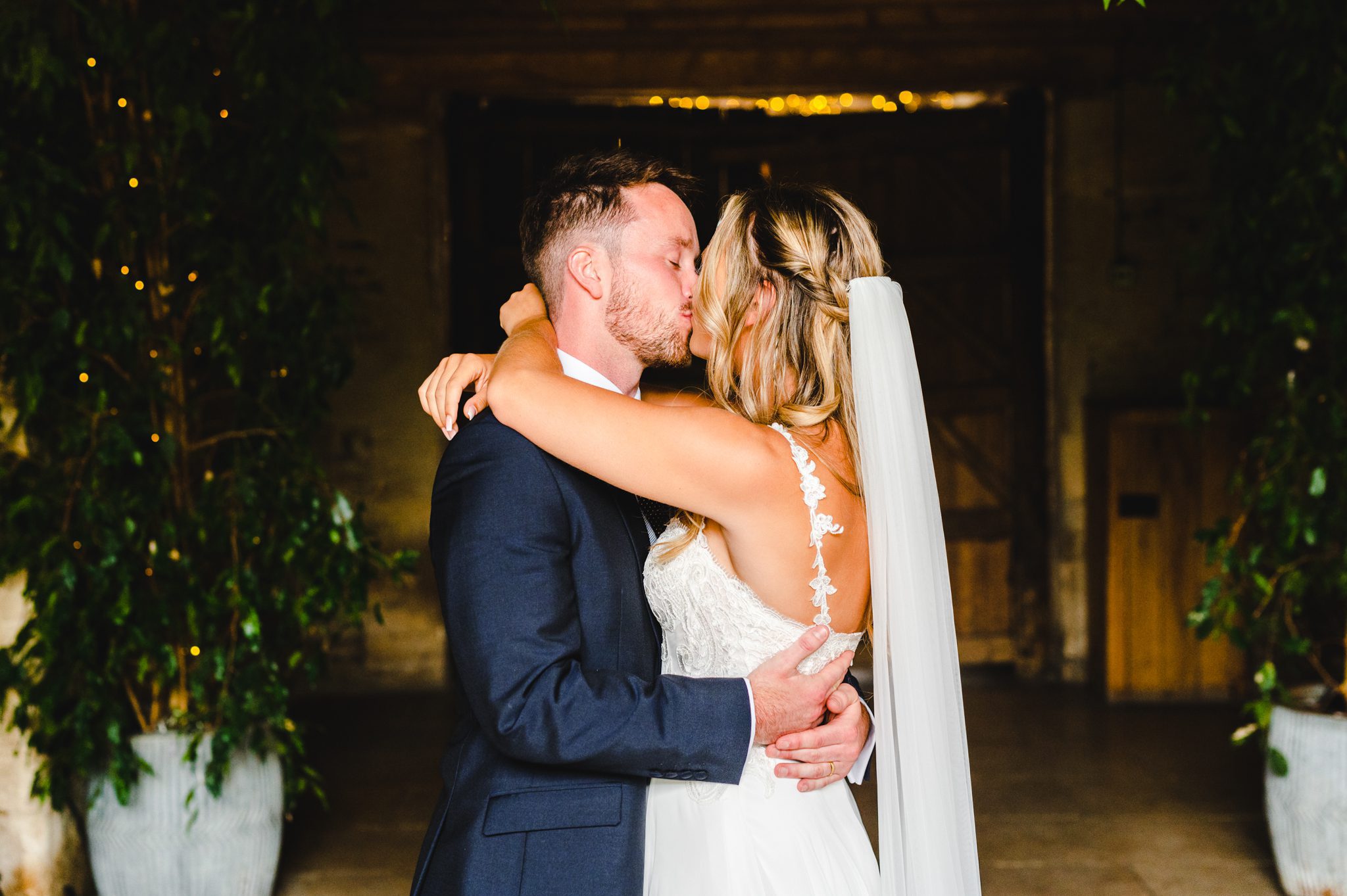 Stone Barn Wedding Photography first kiss for Steph and Dan during their ceremony