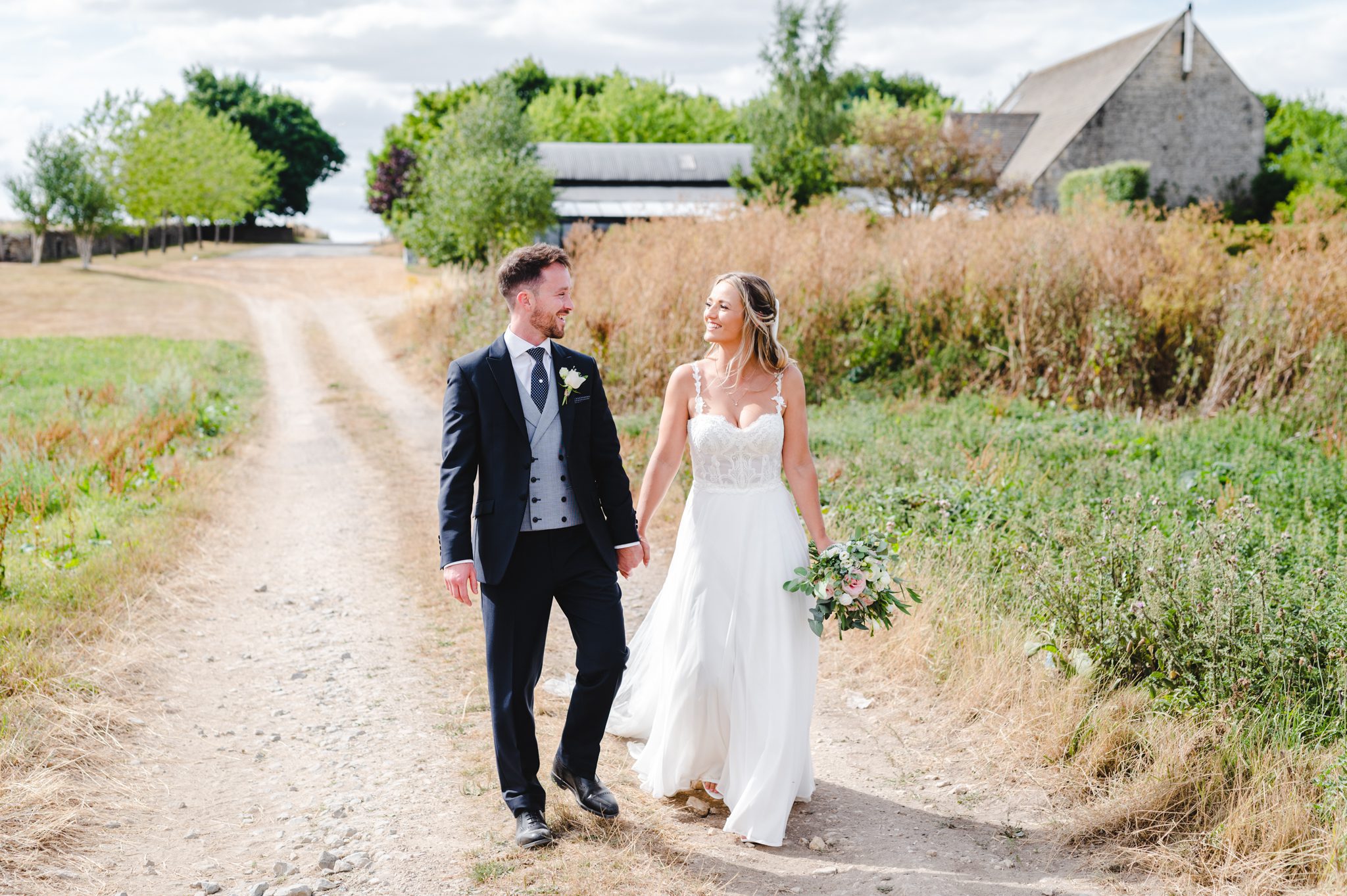 Stone Barn Wedding Photography by Bigeye Photography - Bride and Groom smiling at each other