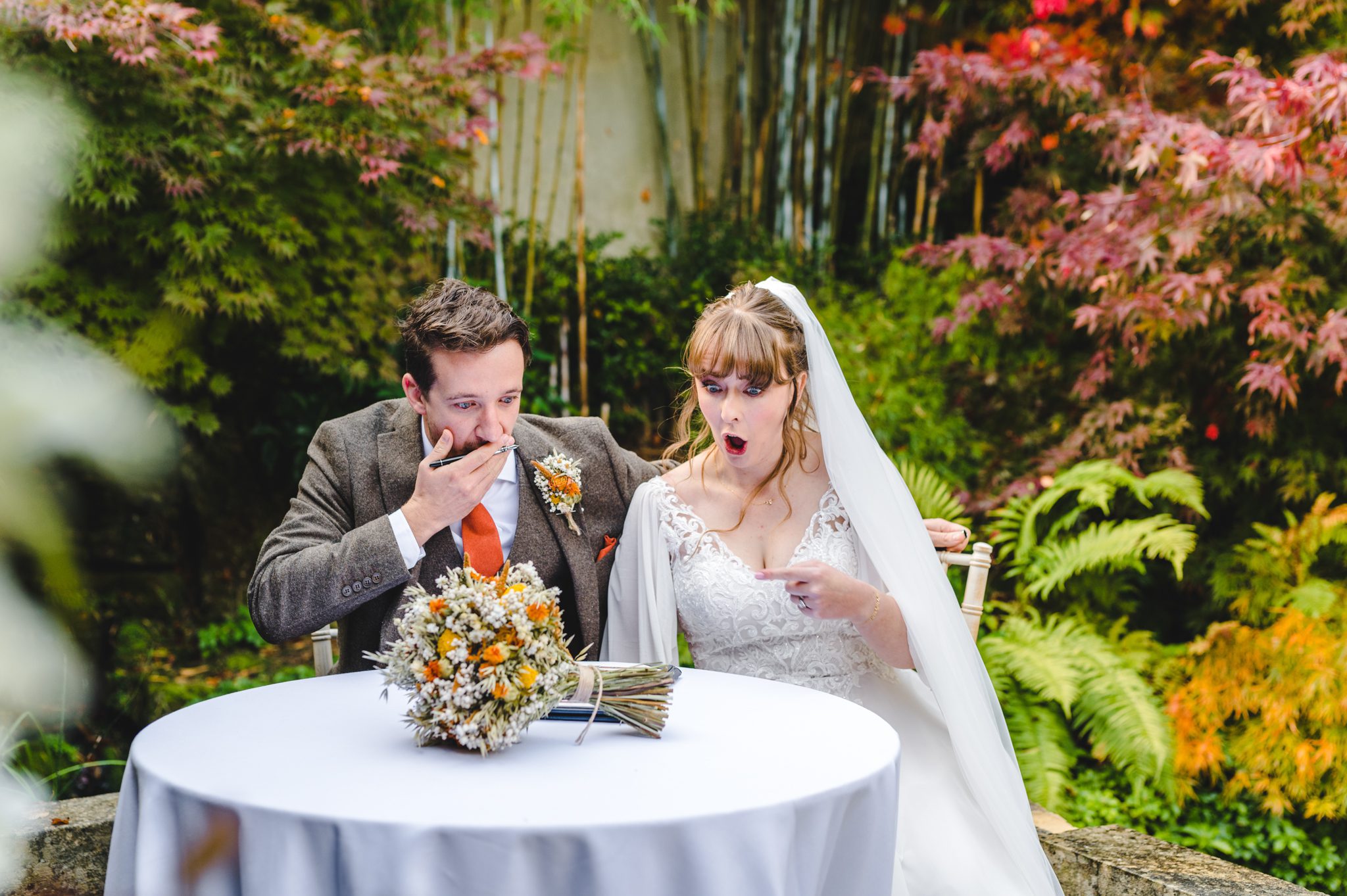Fun photo bride and groom pretend to be shocked at being married