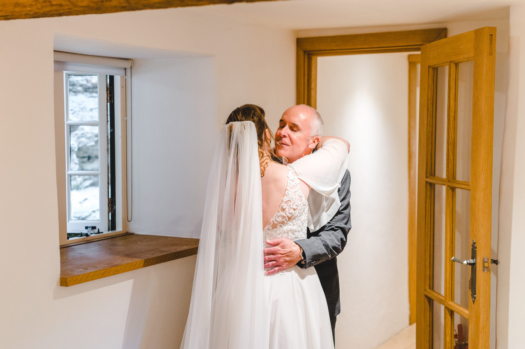 A bride hugging her father before her Matara Centre wedding