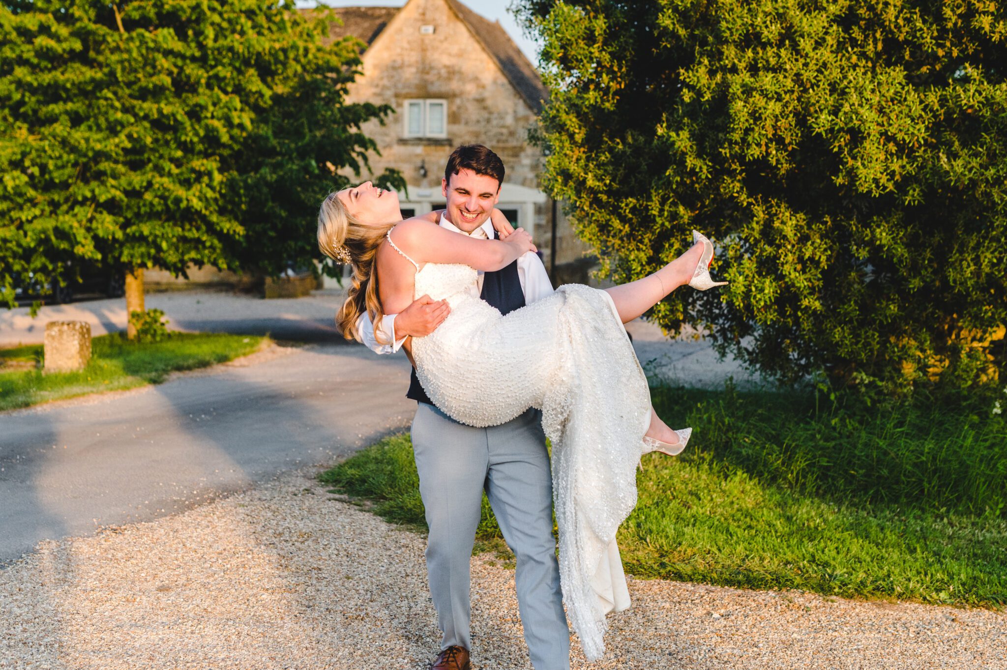 a groom carrying his bride