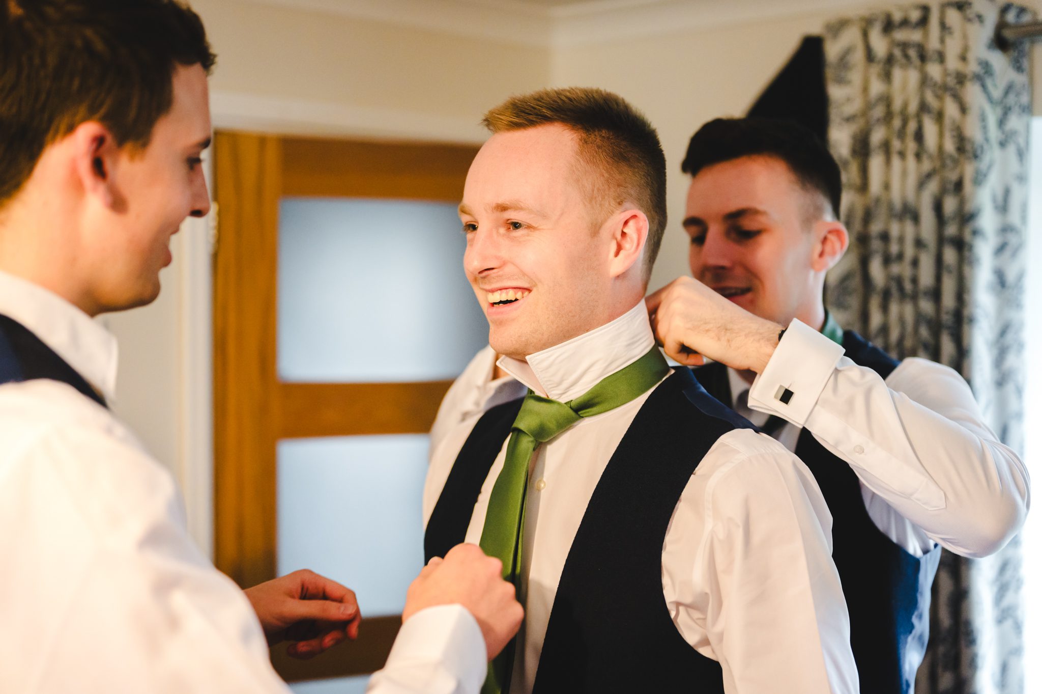 a man wearing a green tie