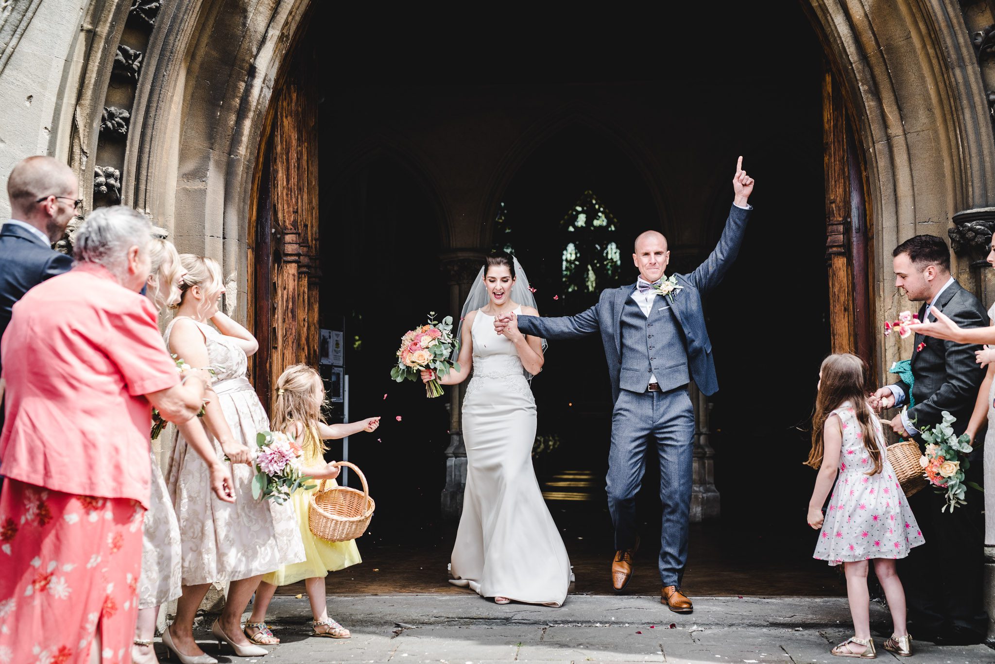 A celebratory arms in the air ceremony exit photo