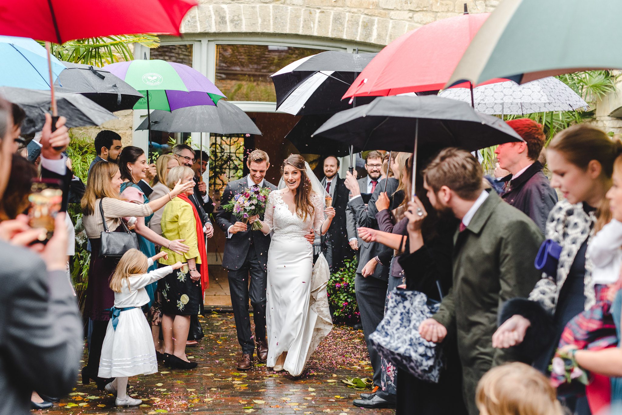 A confetti aisle with umbrellas