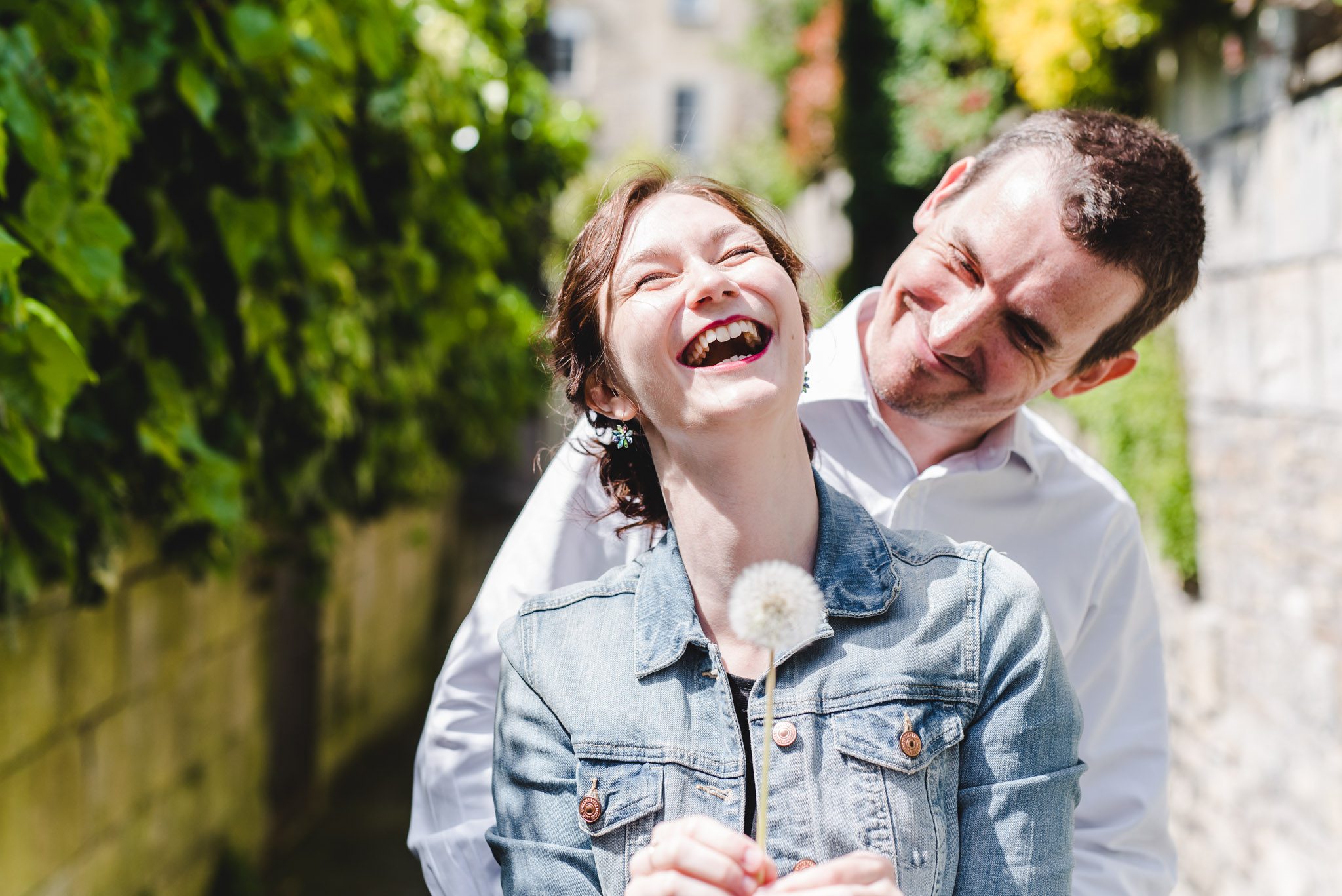 A bride to be holding a dandelion
