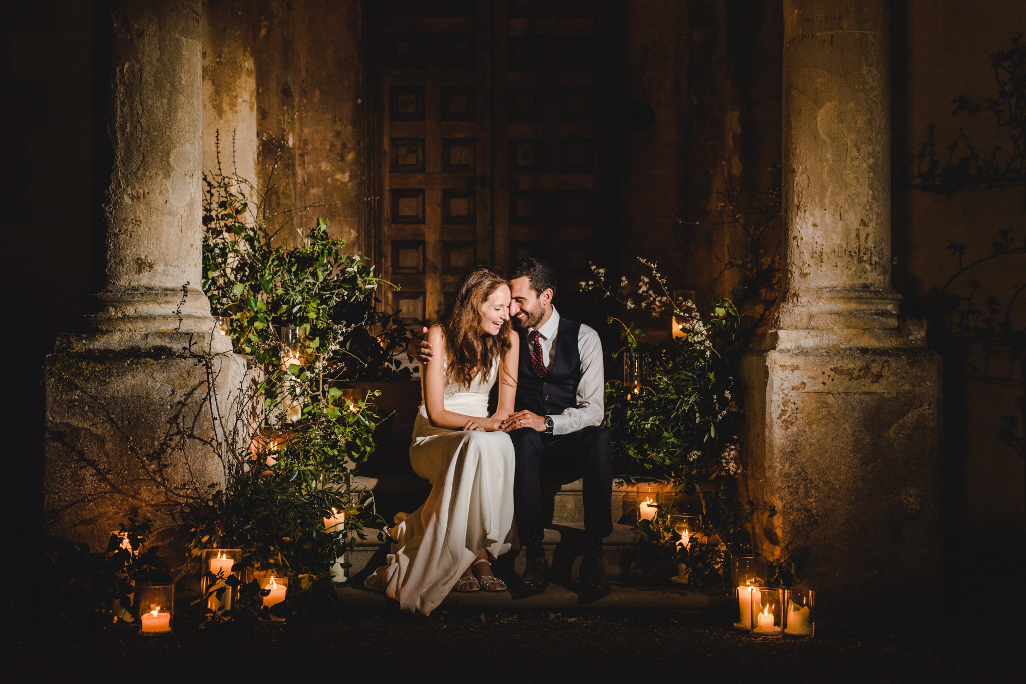 A nighttime portrait on the steps on the main house at Elmore Court