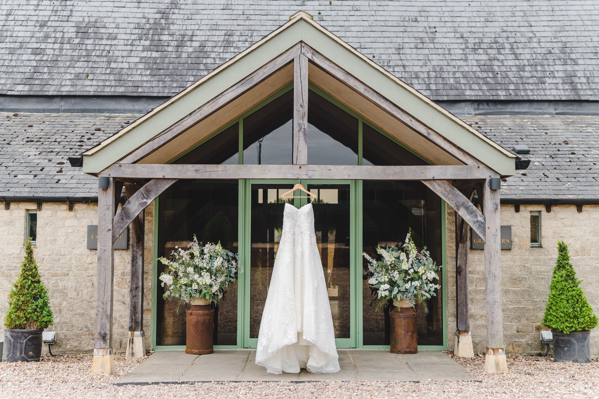 dress hanging up on the outside of a a barn