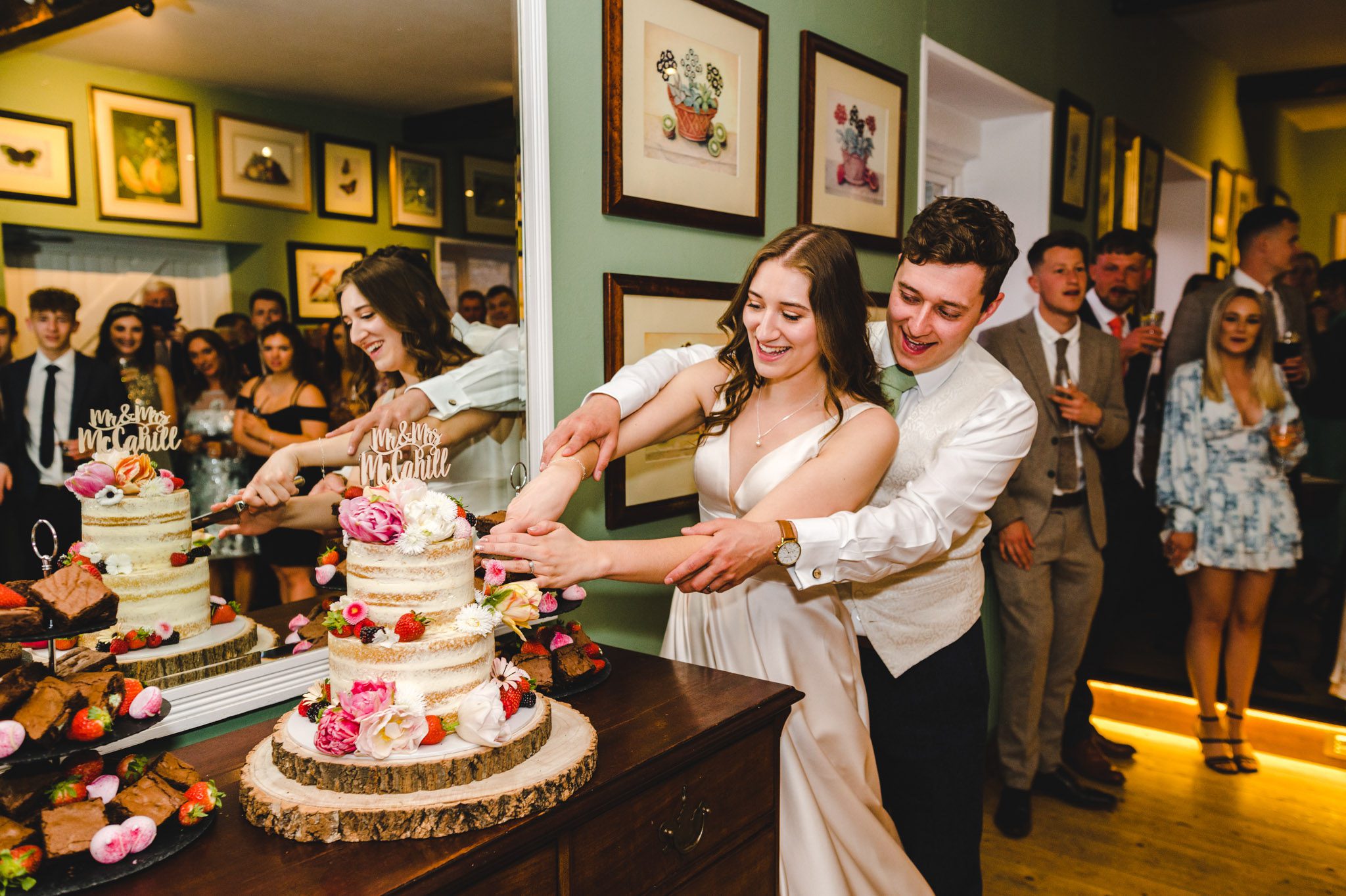 bride and groom cake cutting at Merriscourt