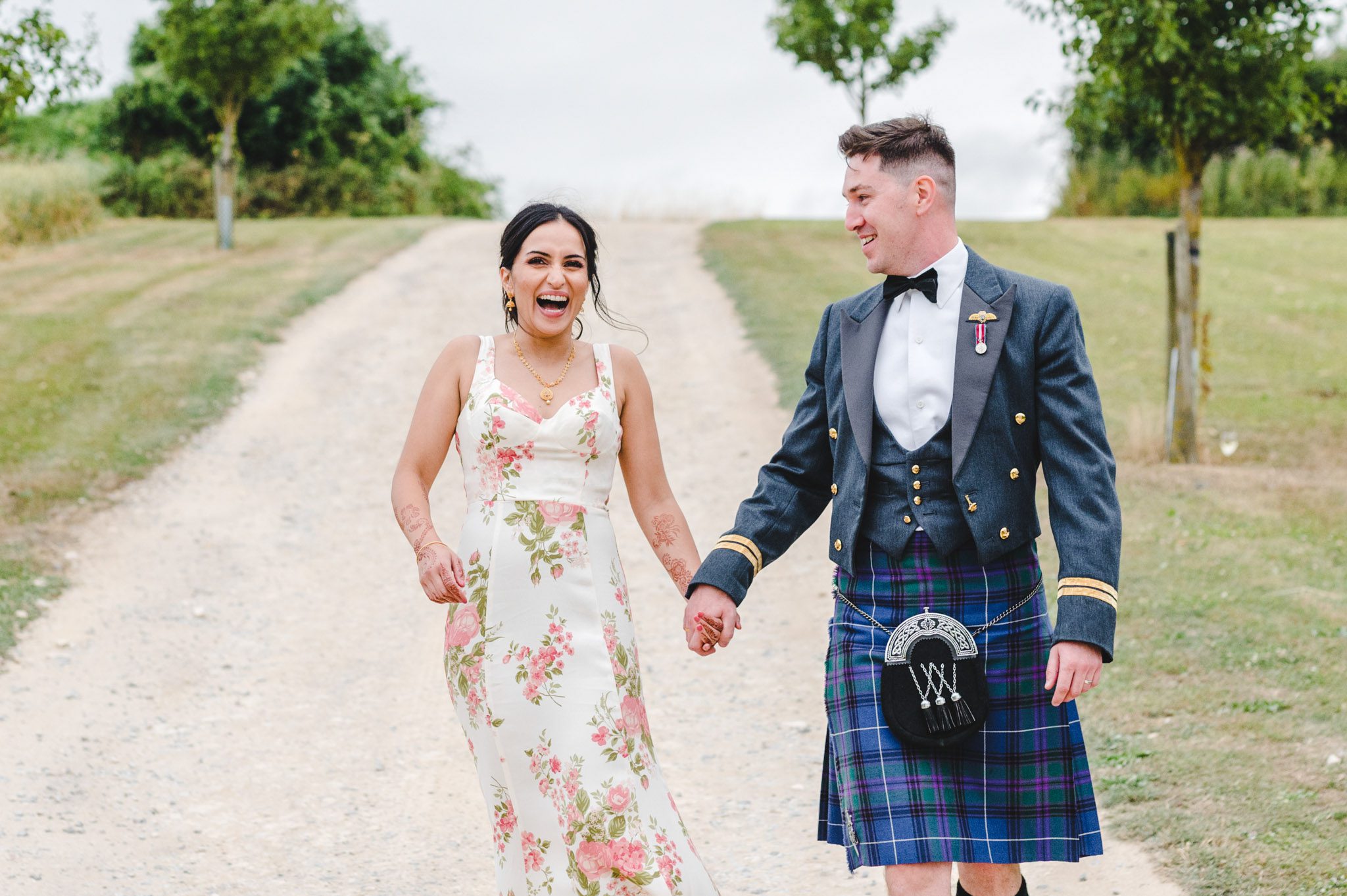 A bride in a second dress at her Upcote Barn wedding day