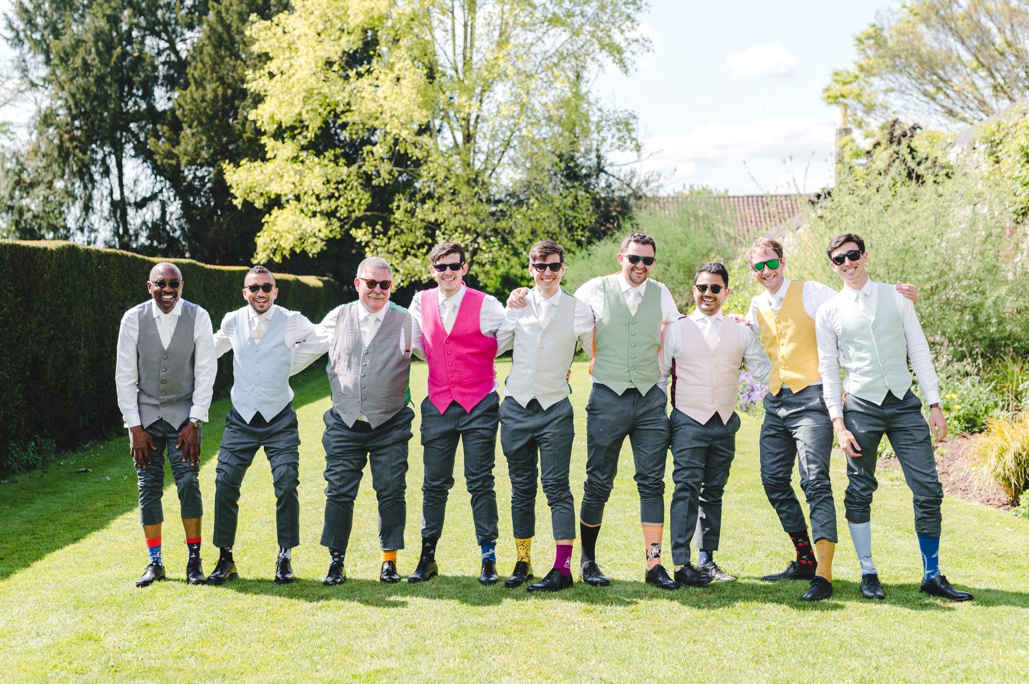 Groomsmen in multi-coloured socks