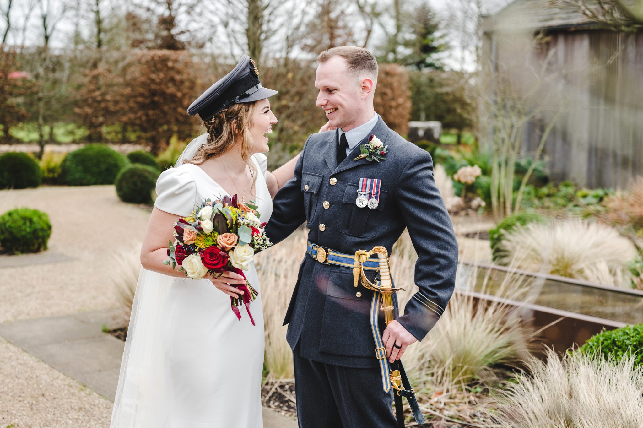 a couple celebrating their military wedding day at Clearwell Castle