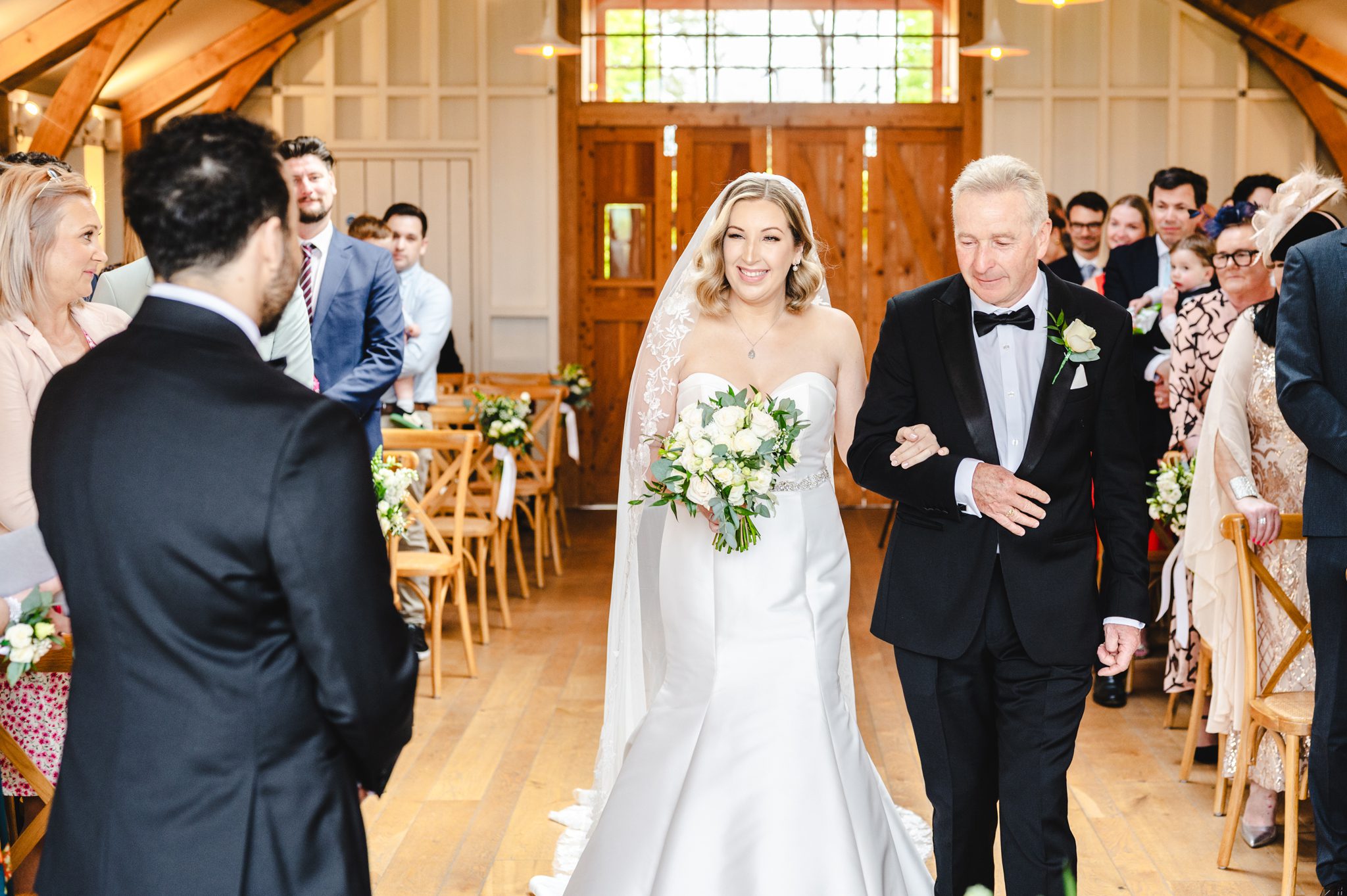 a bride walking in The Grange at Hyde House